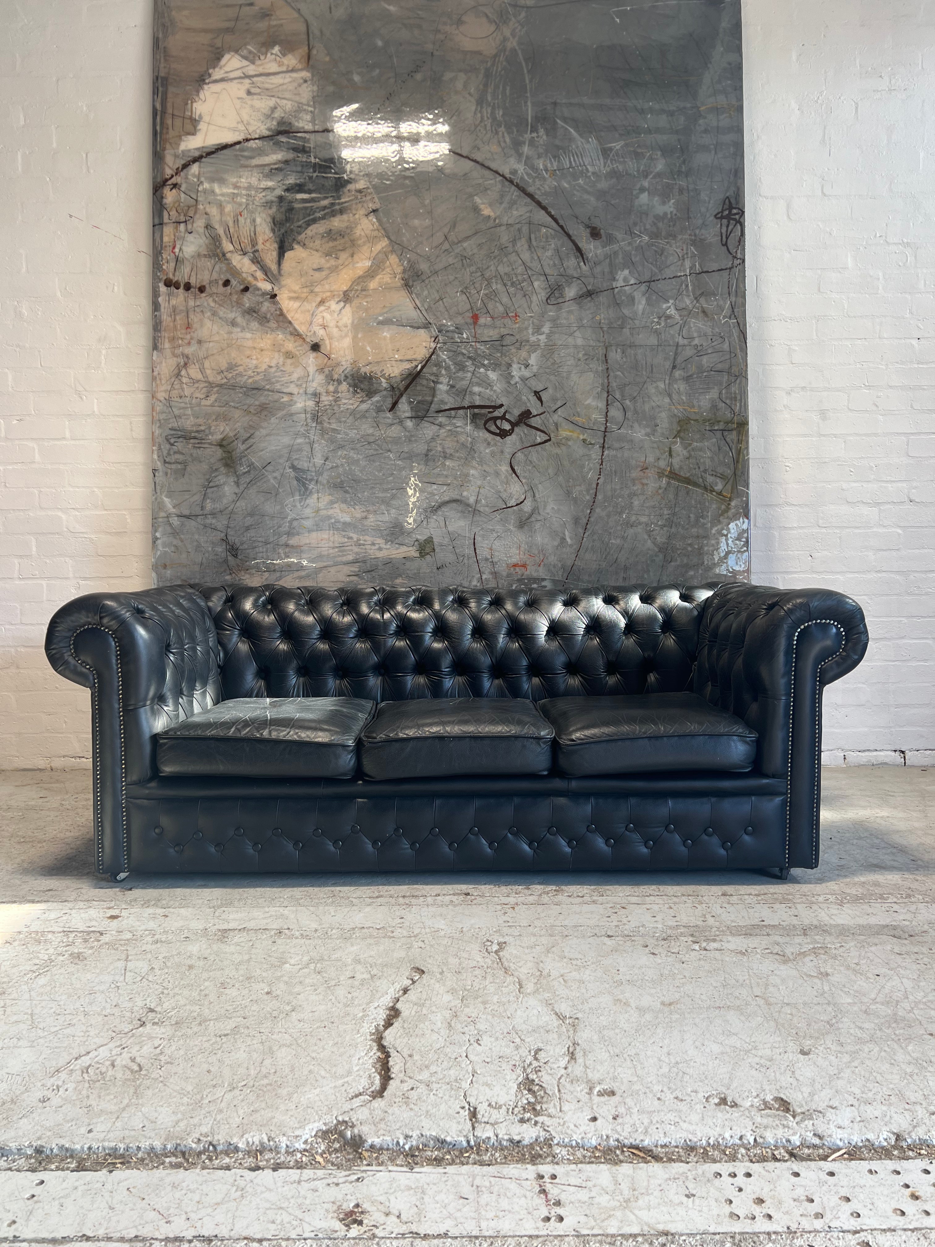 A Great Black Leather Chesterfield Sofa