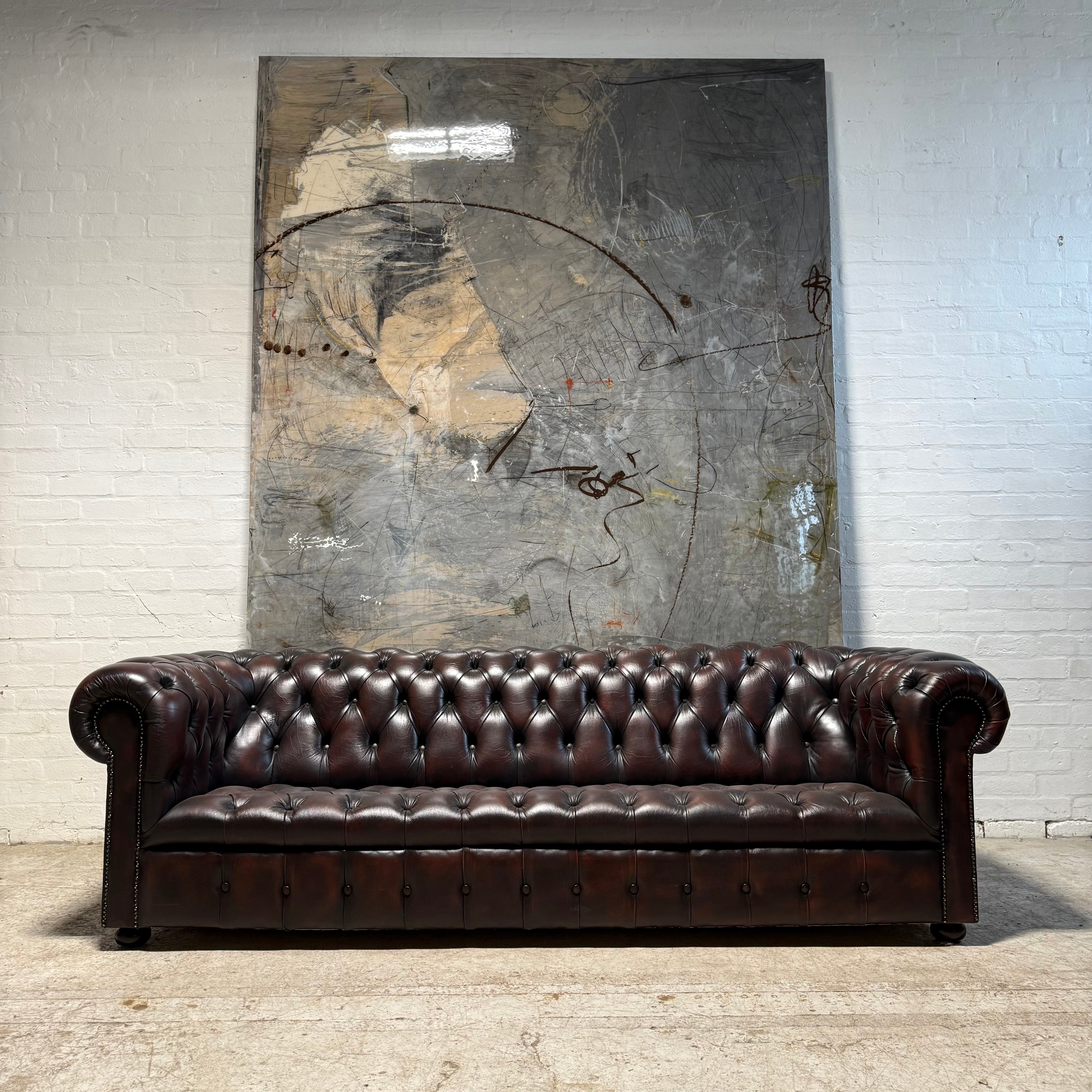An Exceptional Second Hand Leather Chesterfield Sofa - 4 Seater in Dark Conker Brown