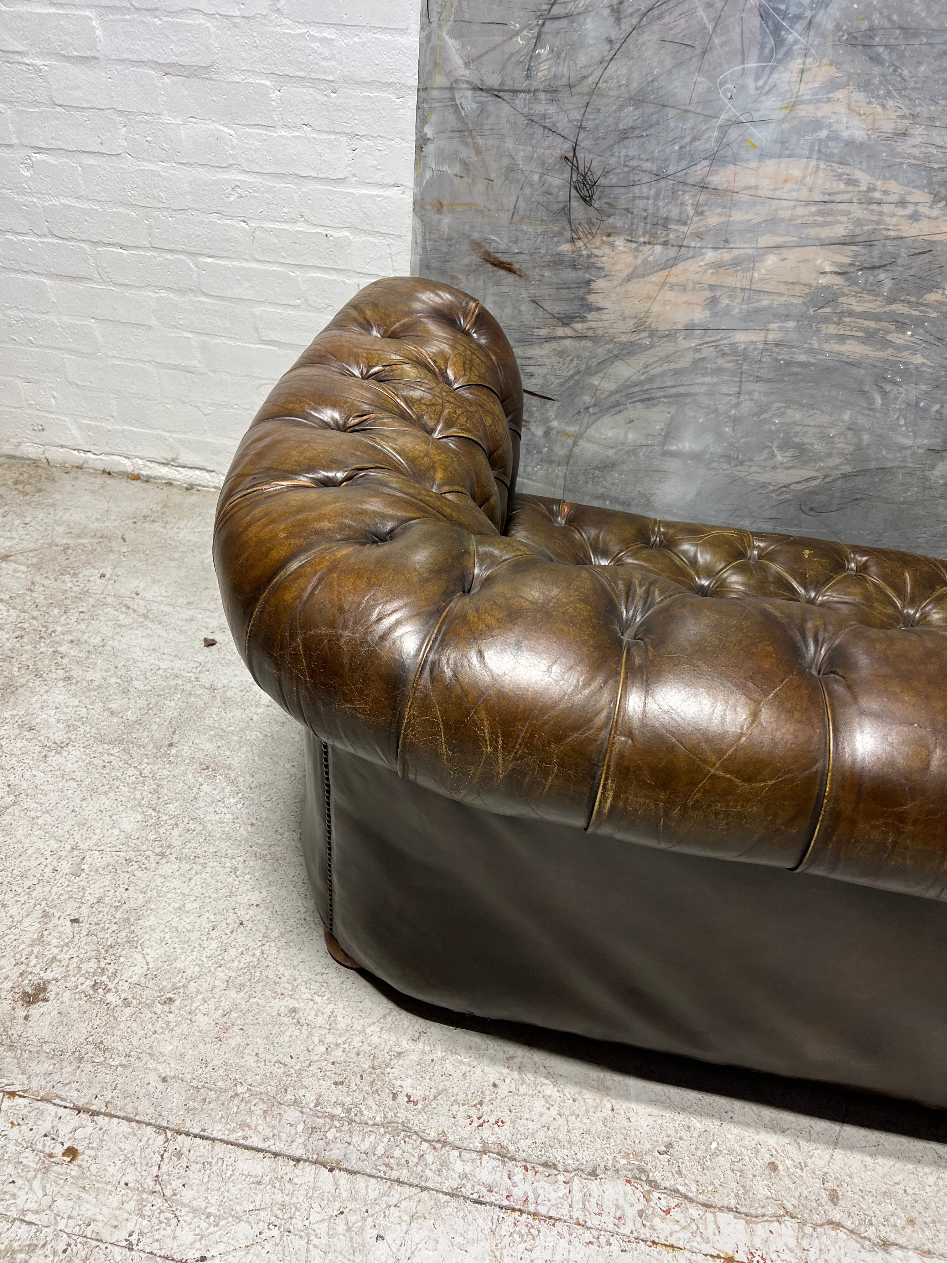 From Robbie William’s Compton Basset House - A Very Good MidC Hand Dyed Leather Chesterfield Sofa