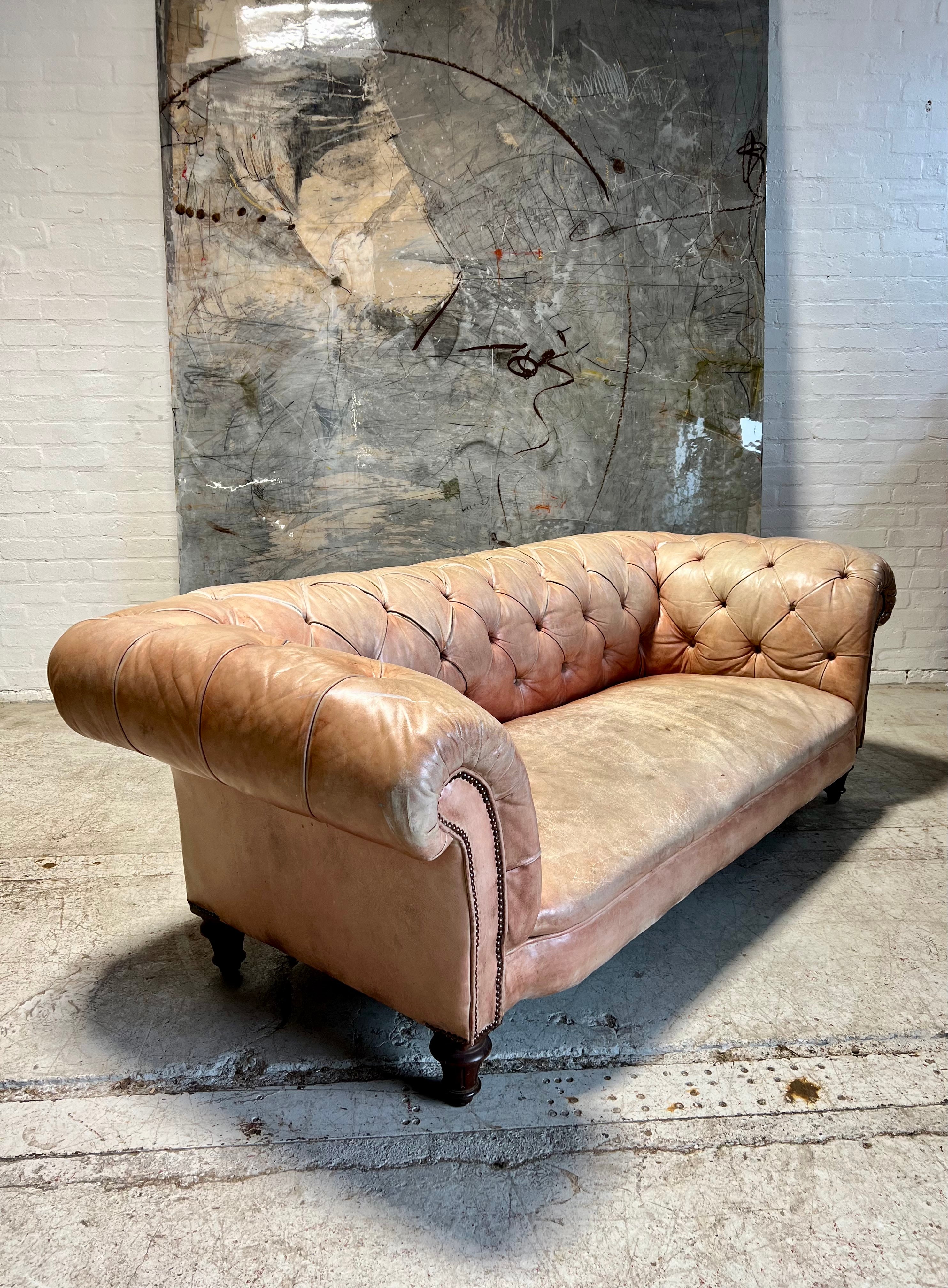 A Waring & Gillow Chesterfield Sofa in Faded Coral Hand Dyed Leathers