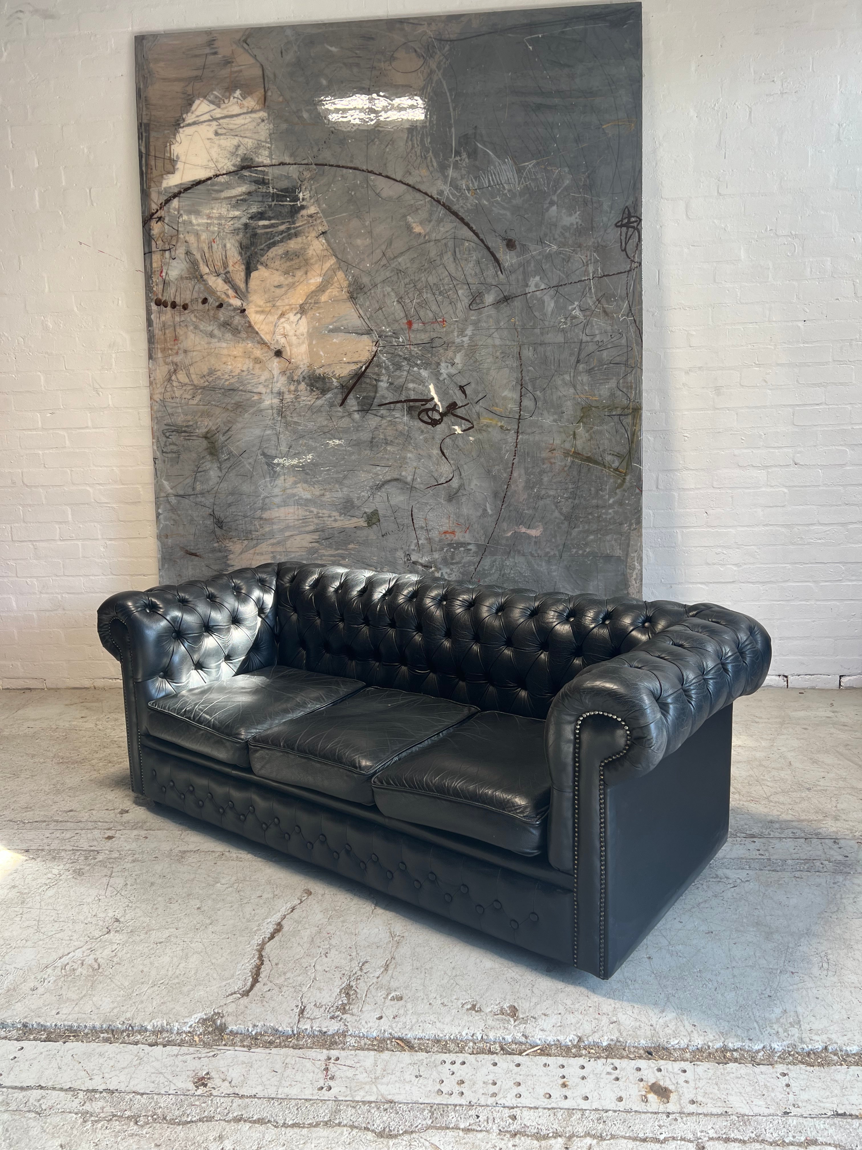 A Great Black Leather Chesterfield Sofa