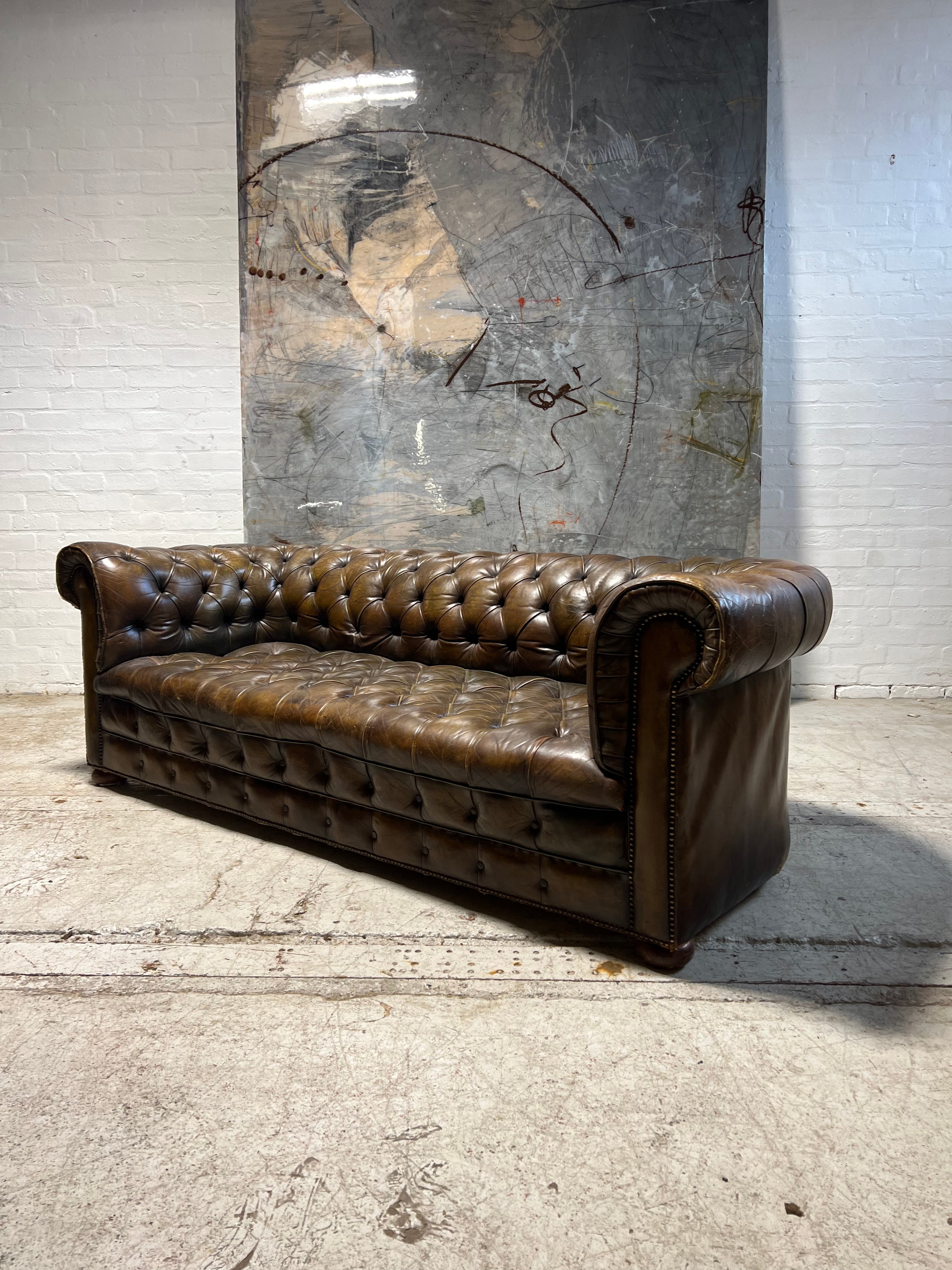 From Robbie William’s Compton Basset House - A Very Good MidC Hand Dyed Leather Chesterfield Sofa