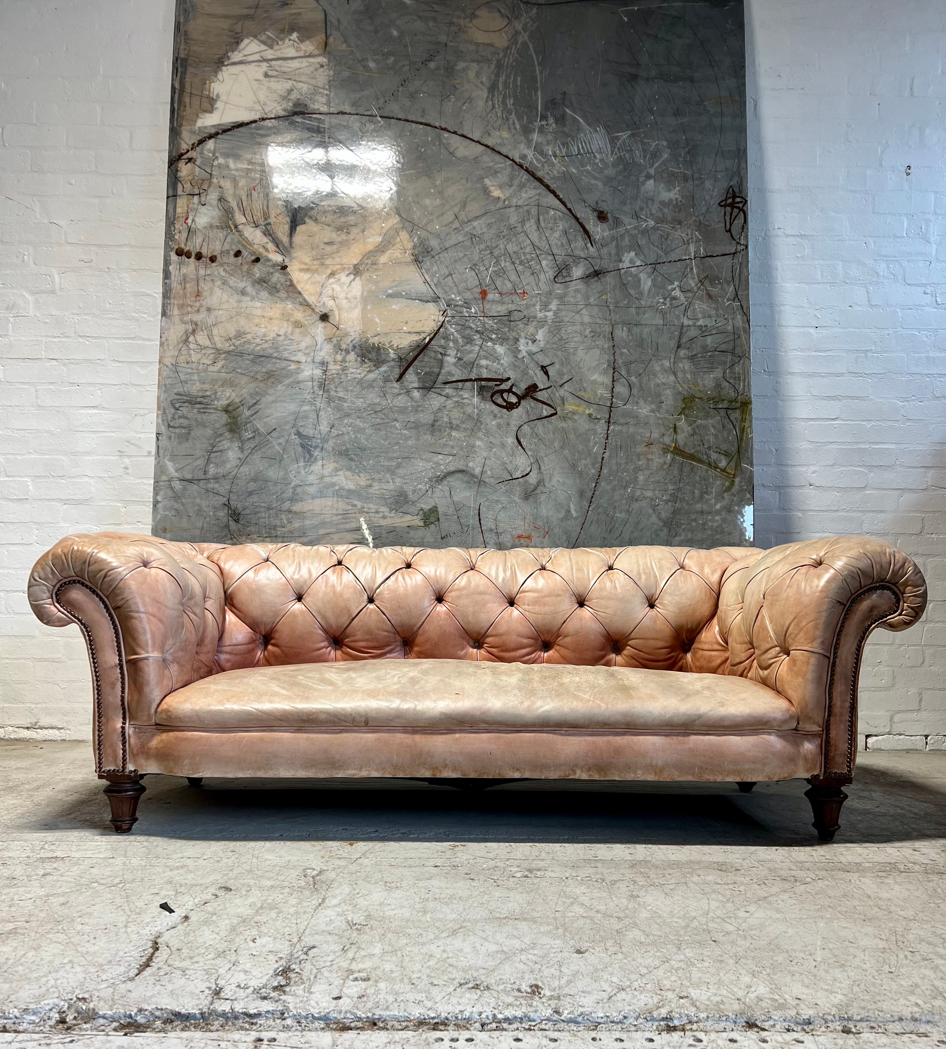 A Waring & Gillow Chesterfield Sofa in Faded Coral Hand Dyed Leathers