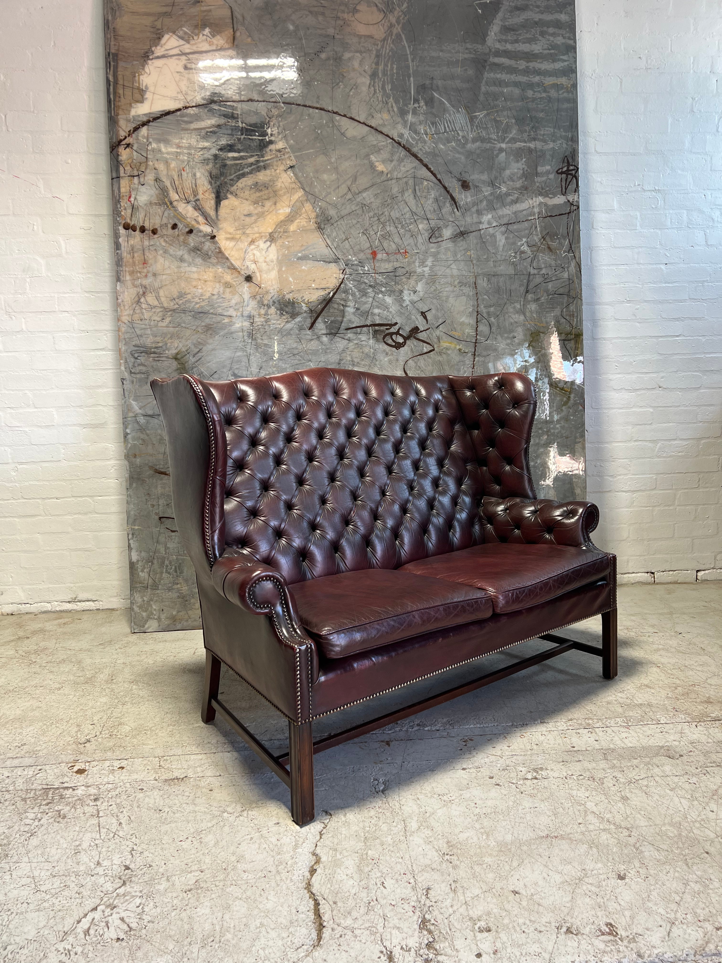 A Very Handsome MidC 2 Seat Wingback Chesterfield Sofa in Hand Dyed Wine Leathers