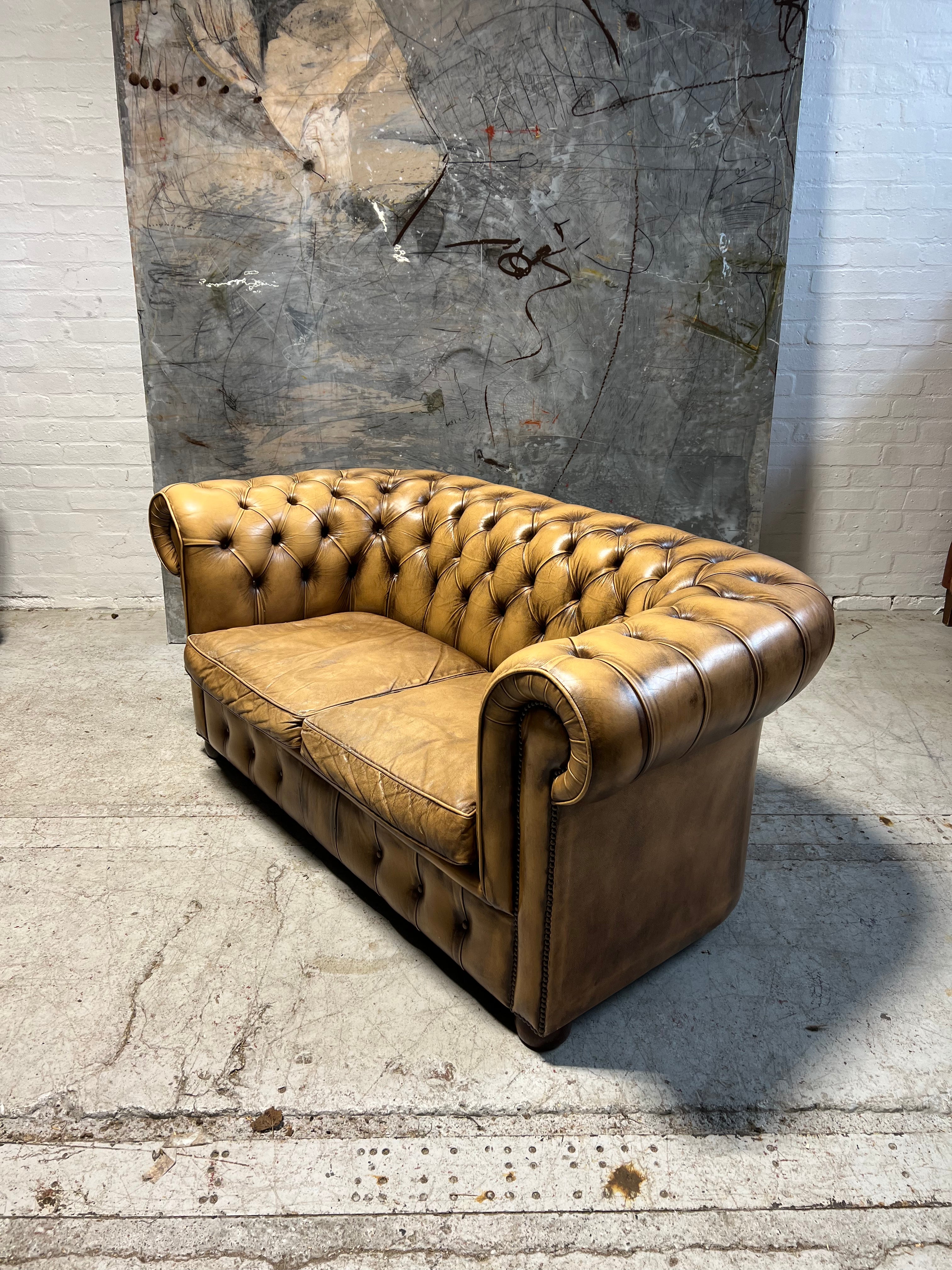 A Great Matching Pair of Light Tan Leather Chesterfield Sofas