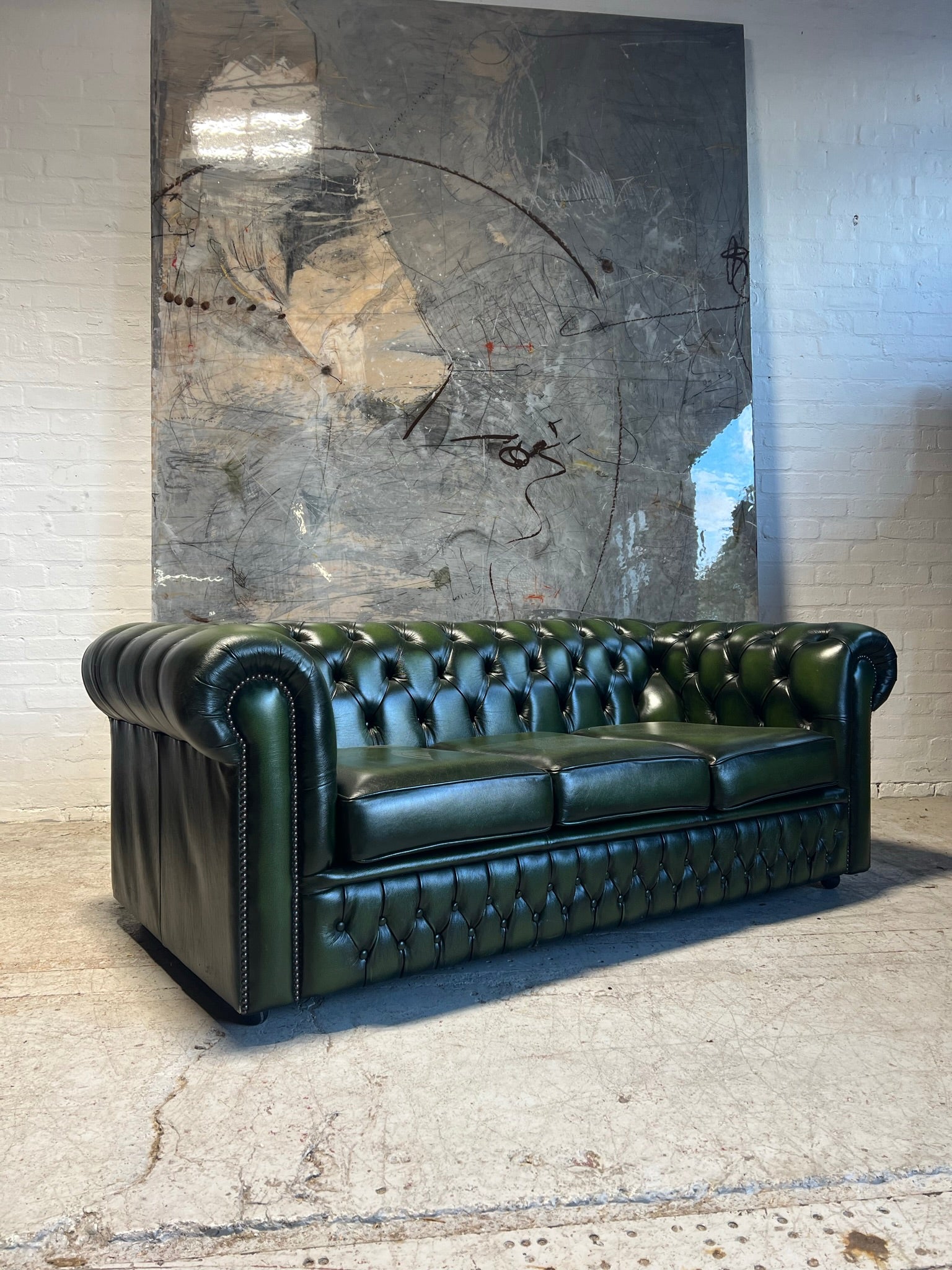 A lovely Rich Green Leather 3 Seater Chesterfield Sofa