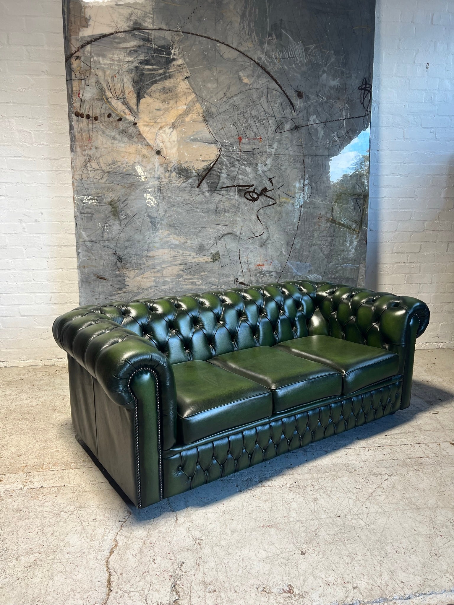 A lovely Rich Green Leather 3 Seater Chesterfield Sofa