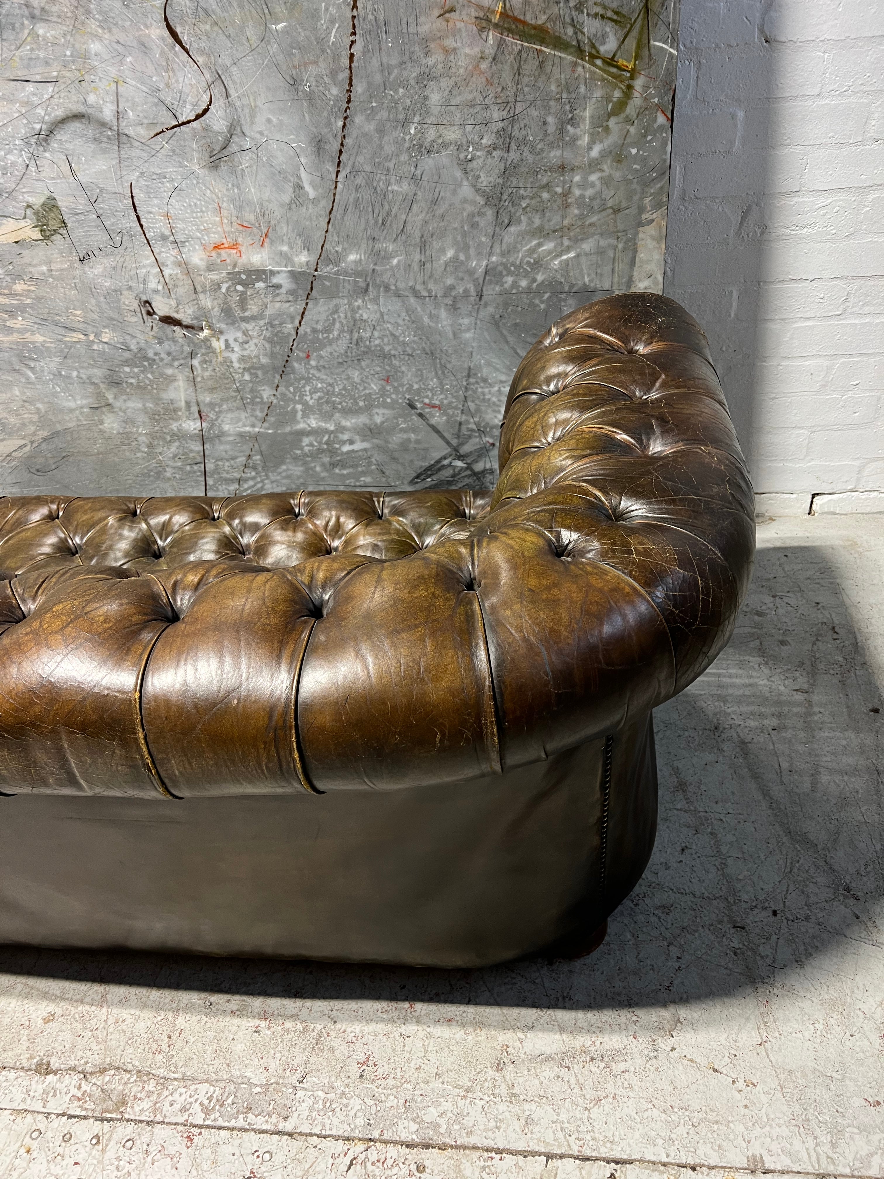 From Robbie William’s Compton Basset House - A Very Good MidC Hand Dyed Leather Chesterfield Sofa