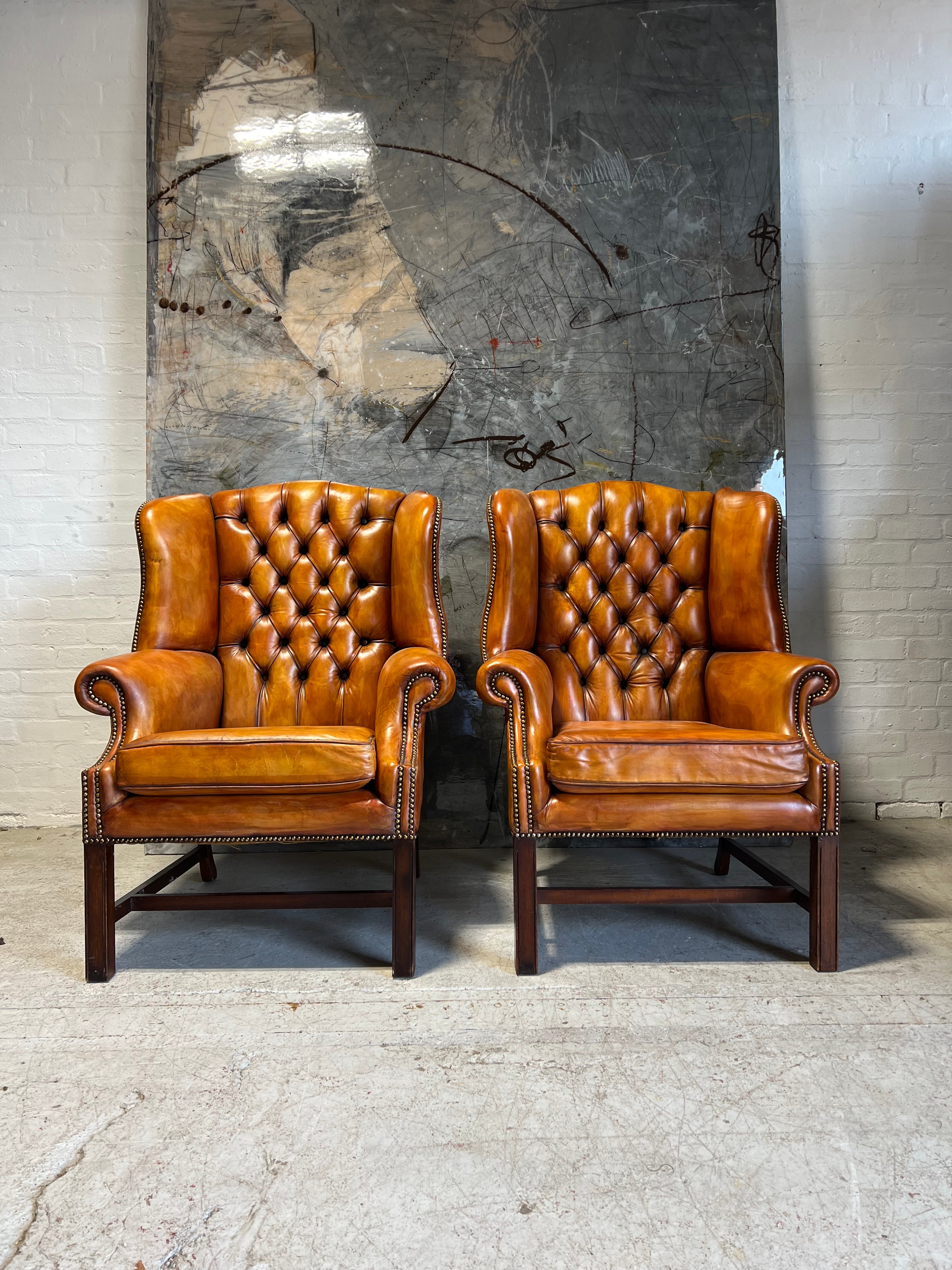 An Stunning Matching Pair of MidC Gentleman’s Wing Chairs in Original Leathers