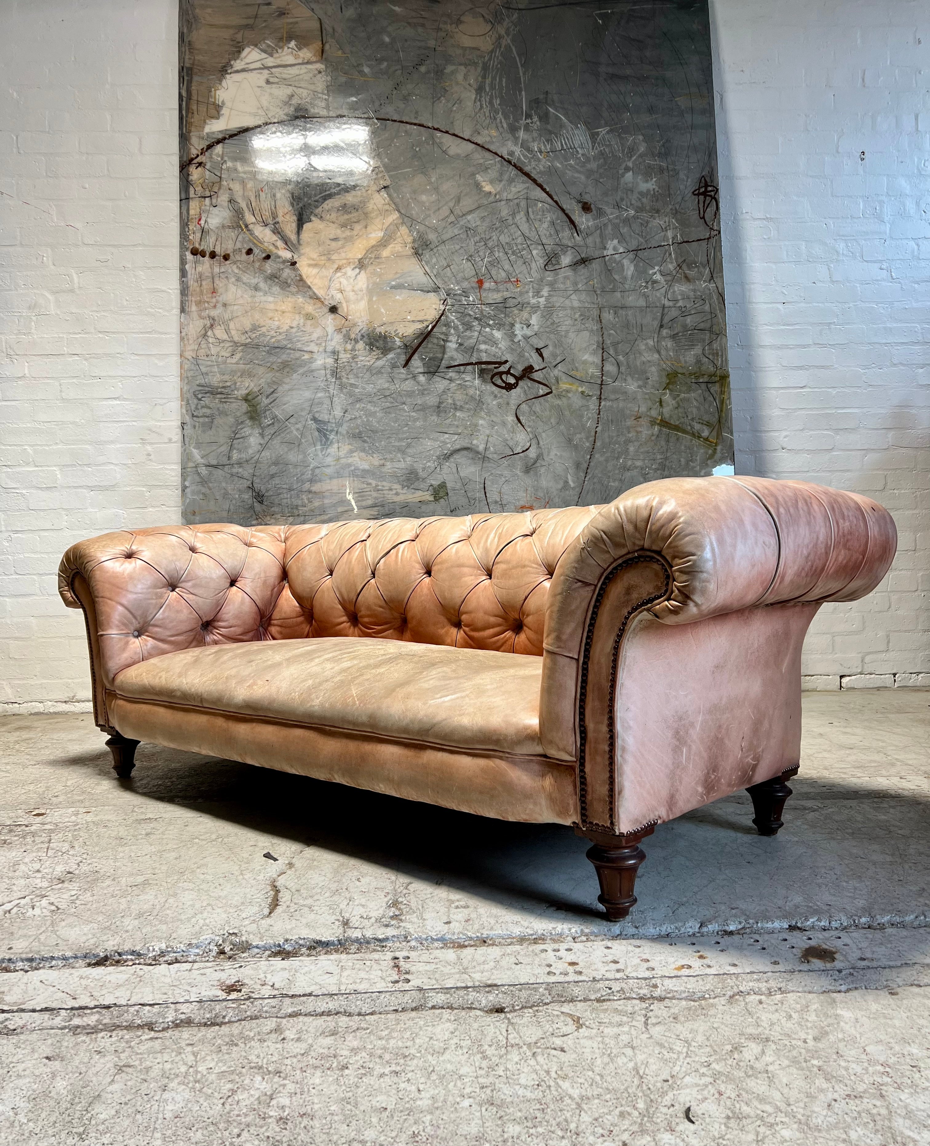 A Waring & Gillow Chesterfield Sofa in Faded Coral Hand Dyed Leathers