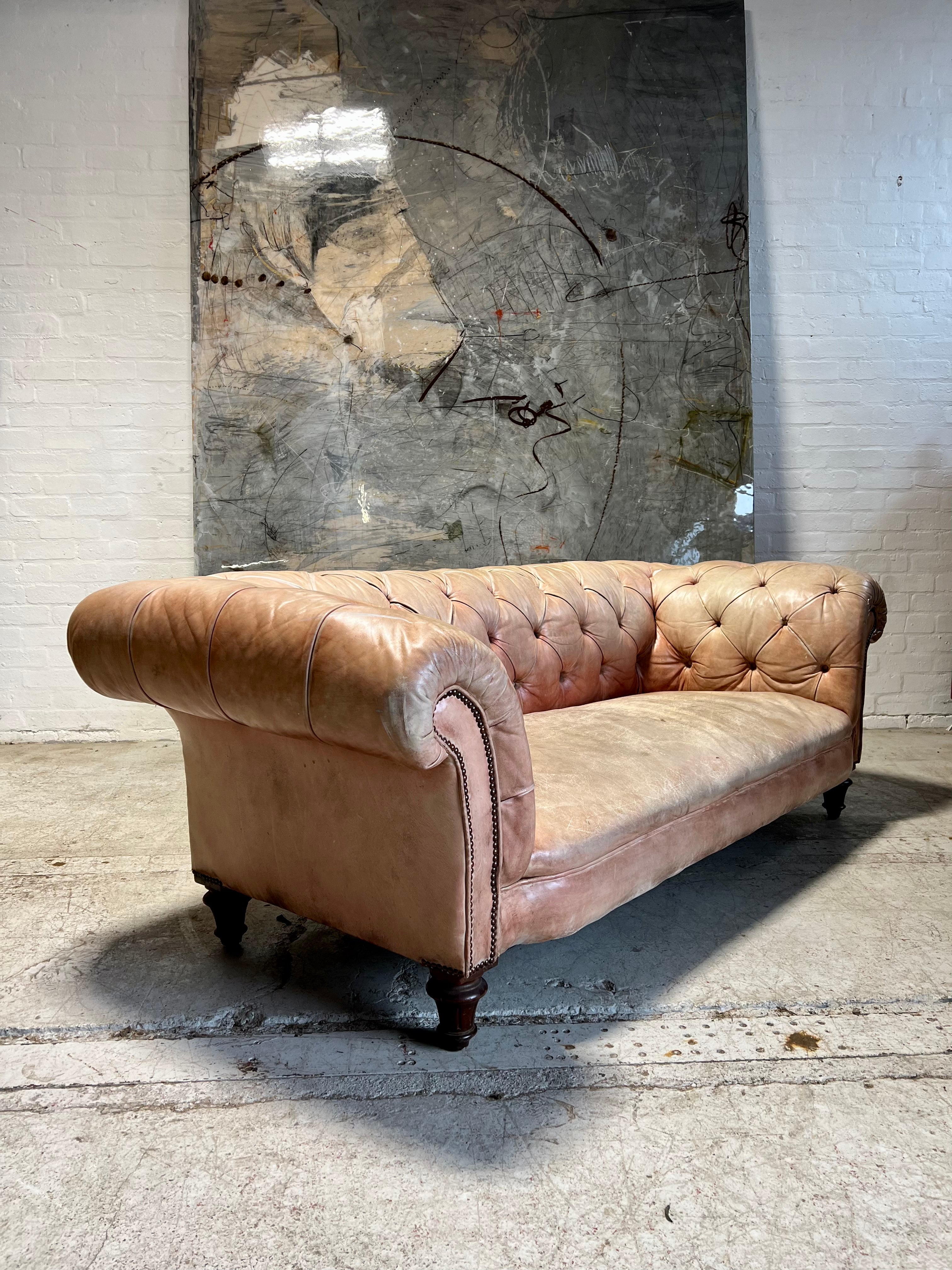 A Waring & Gillow Chesterfield Sofa in Faded Coral Hand Dyed Leathers