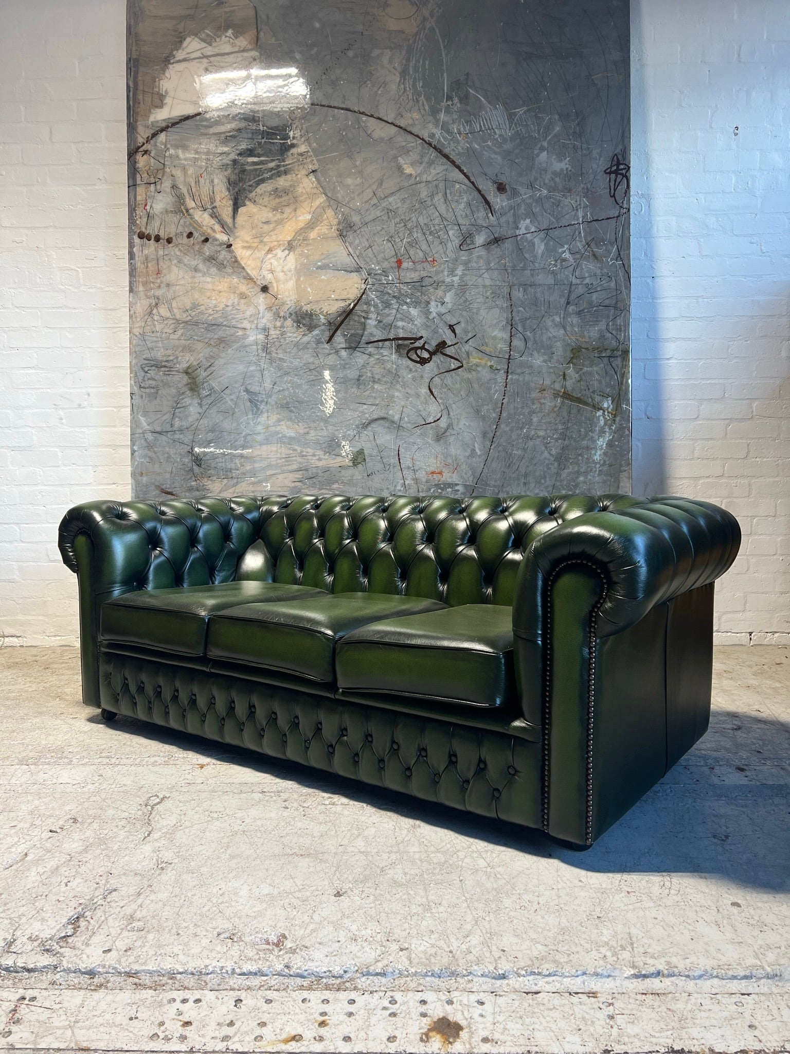 A lovely Rich Green Leather 3 Seater Chesterfield Sofa