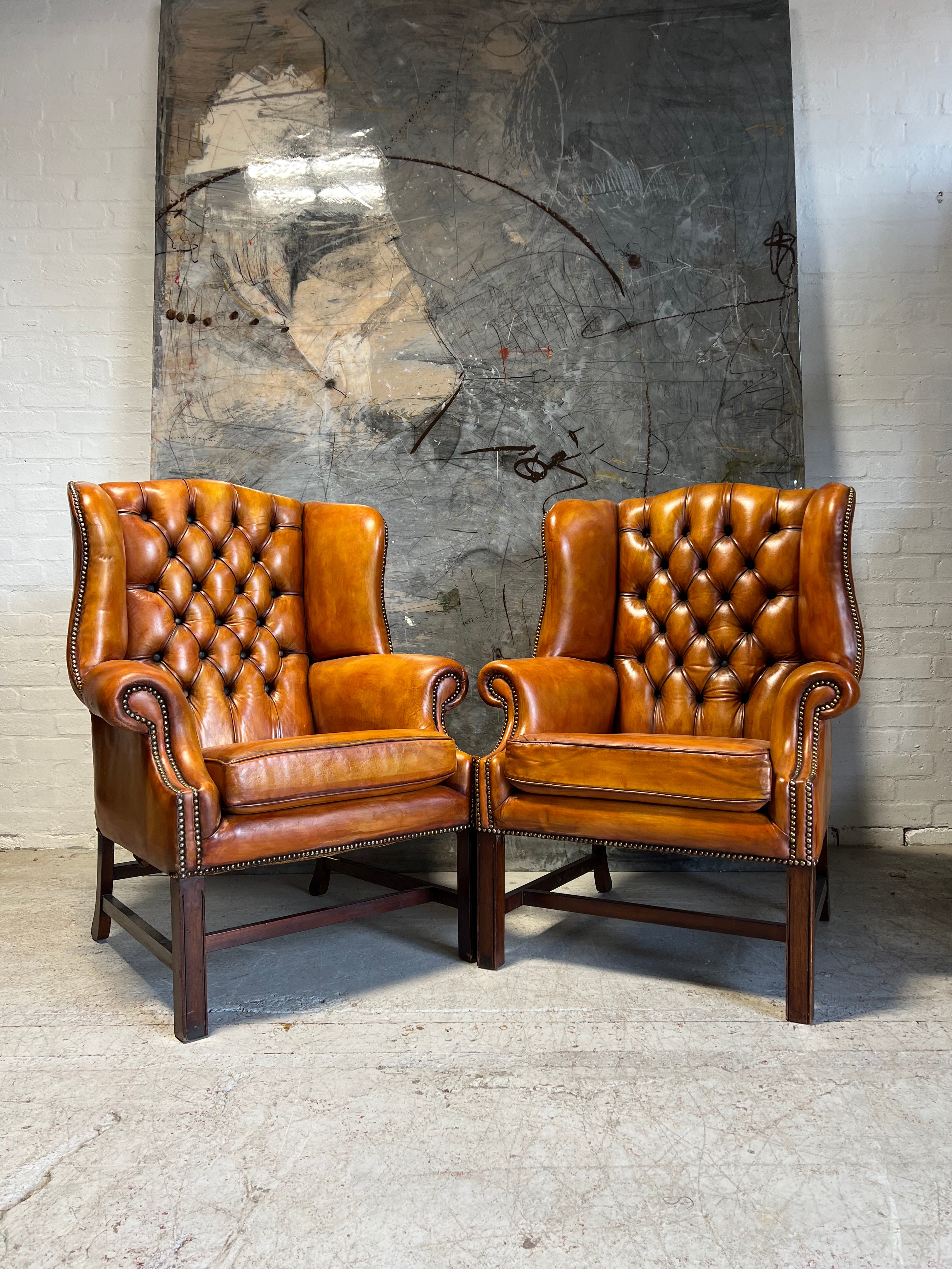 An Stunning Matching Pair of MidC Gentleman’s Wing Chairs in Original Leathers