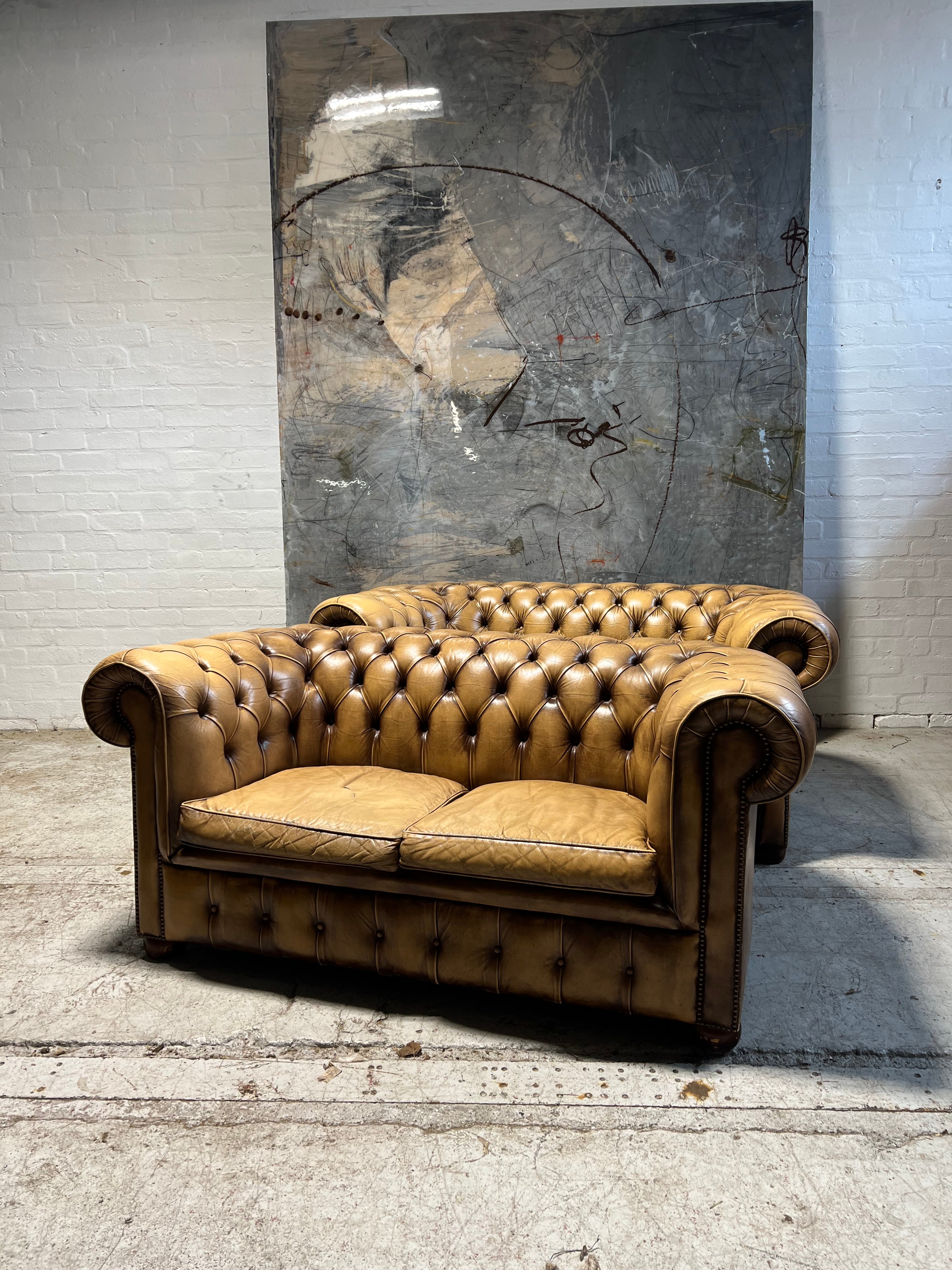 A Great Matching Pair of Light Tan Leather Chesterfield Sofas