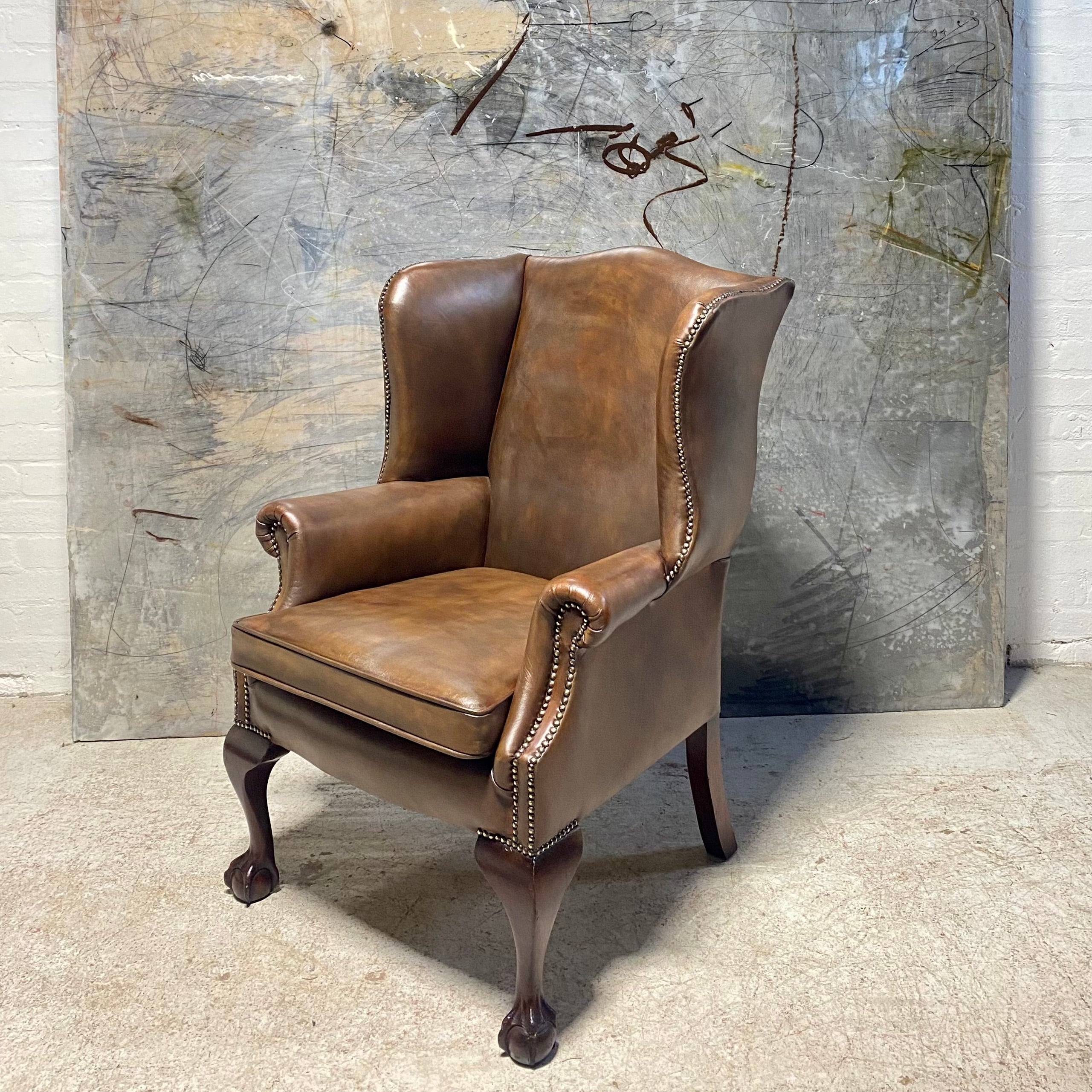 A Beautifully Restored MidC Vintage Gentleman’s Wing Back Chair in Hand Dyed Leather
