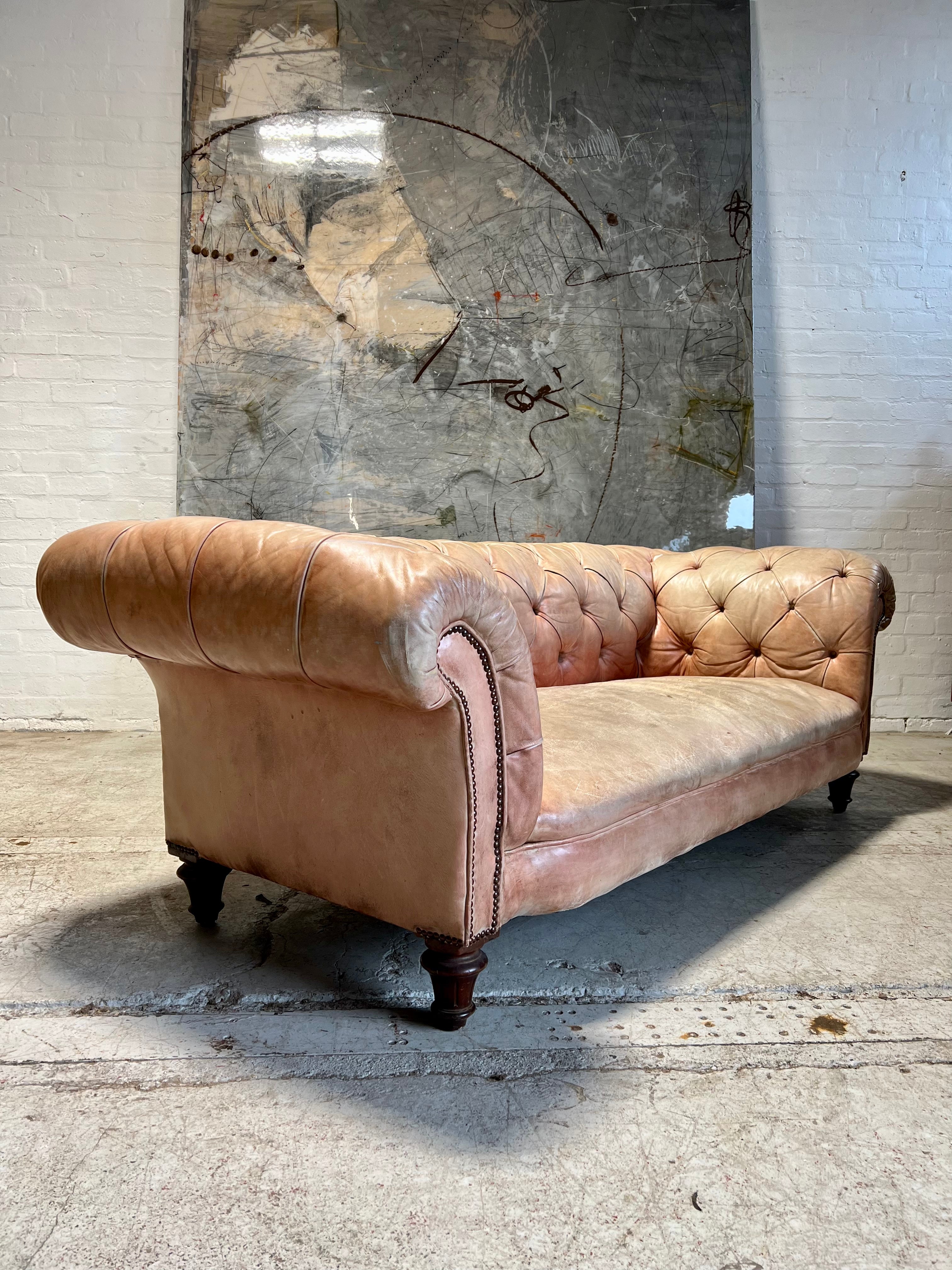 A Waring & Gillow Chesterfield Sofa in Faded Coral Hand Dyed Leathers