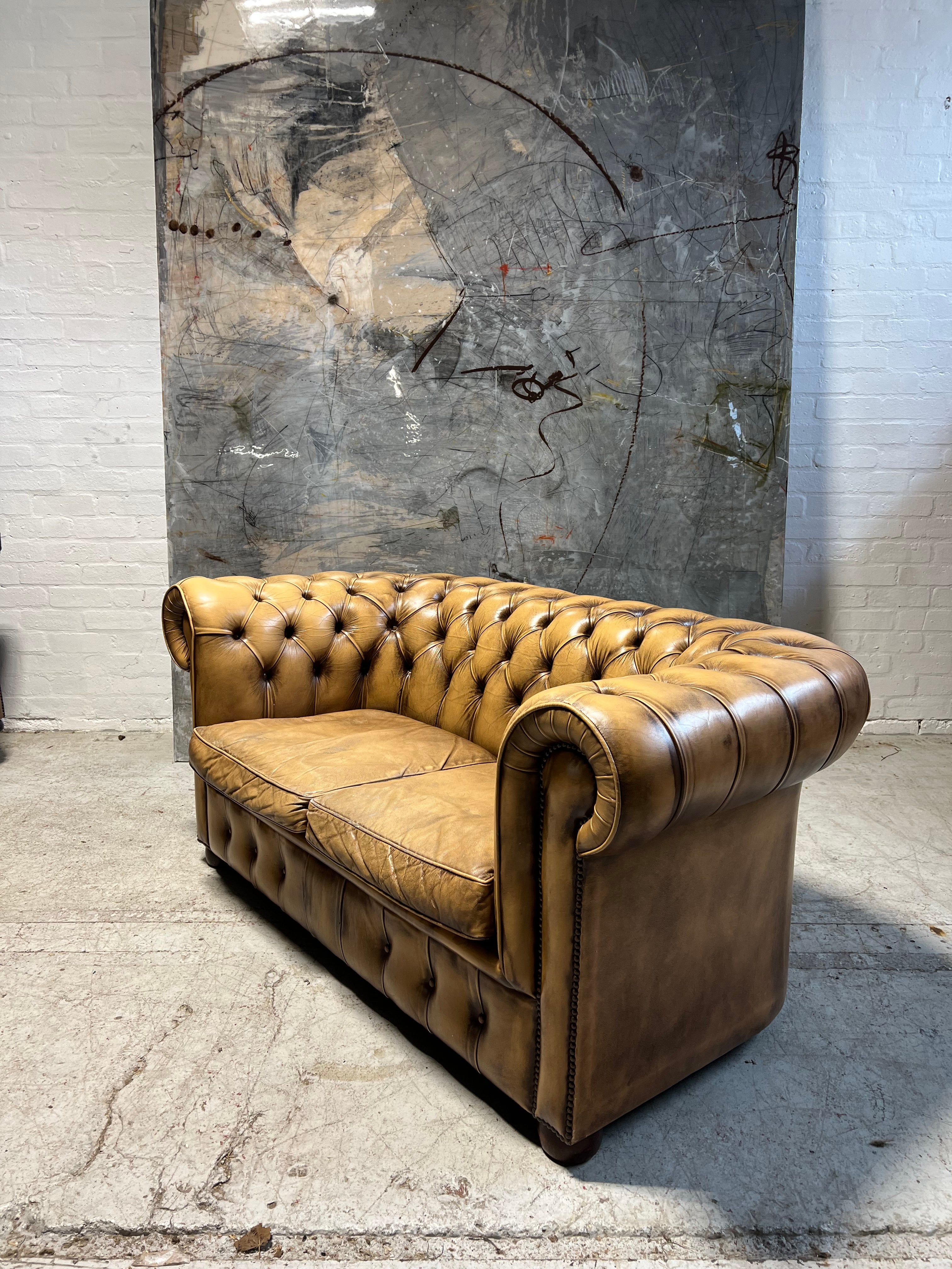 A Great Matching Pair of Light Tan Leather Chesterfield Sofas