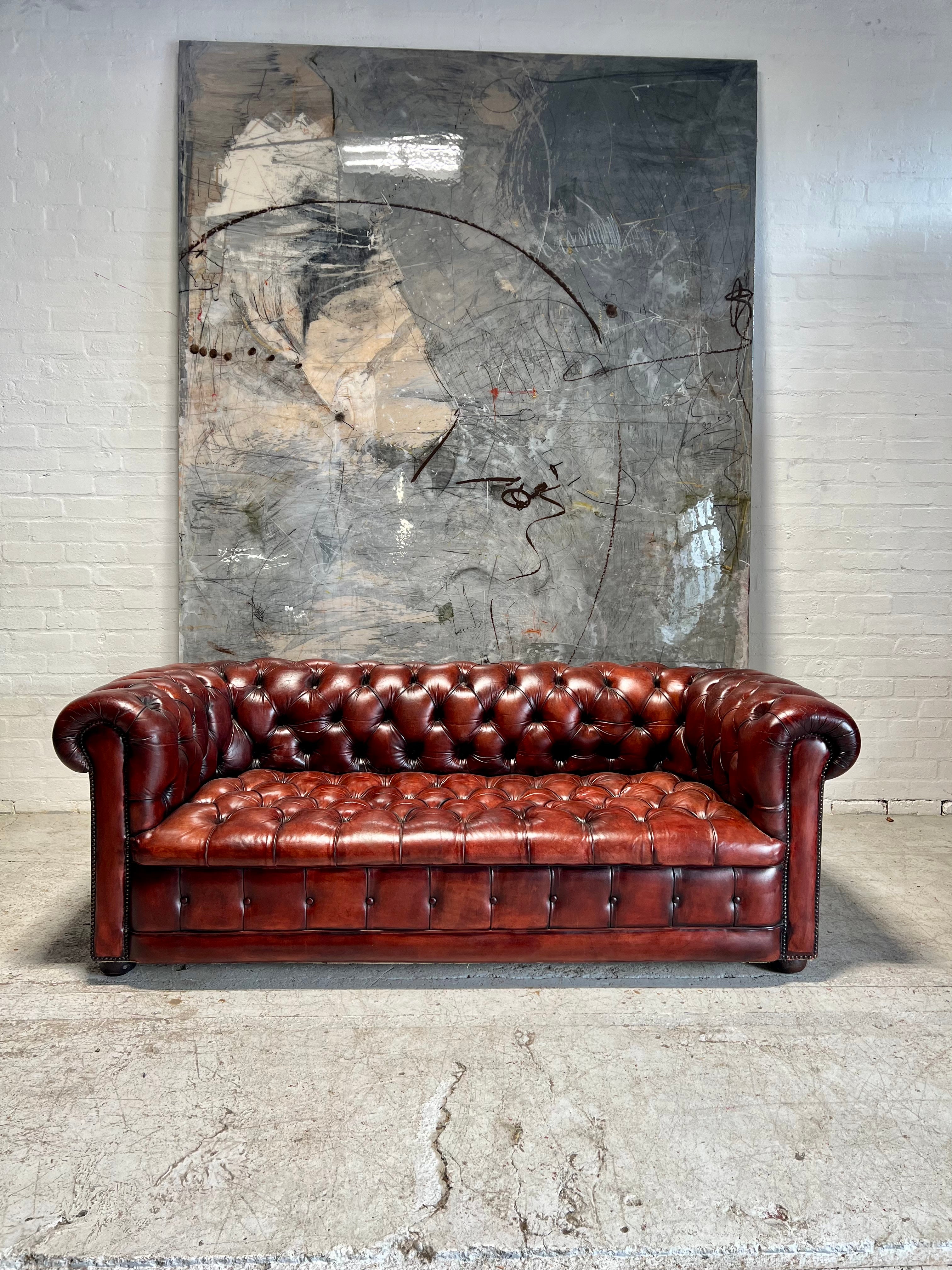 A Beautiful MidC Vintage Leather Chesterfield Sofa in Hand Dyed Cognac