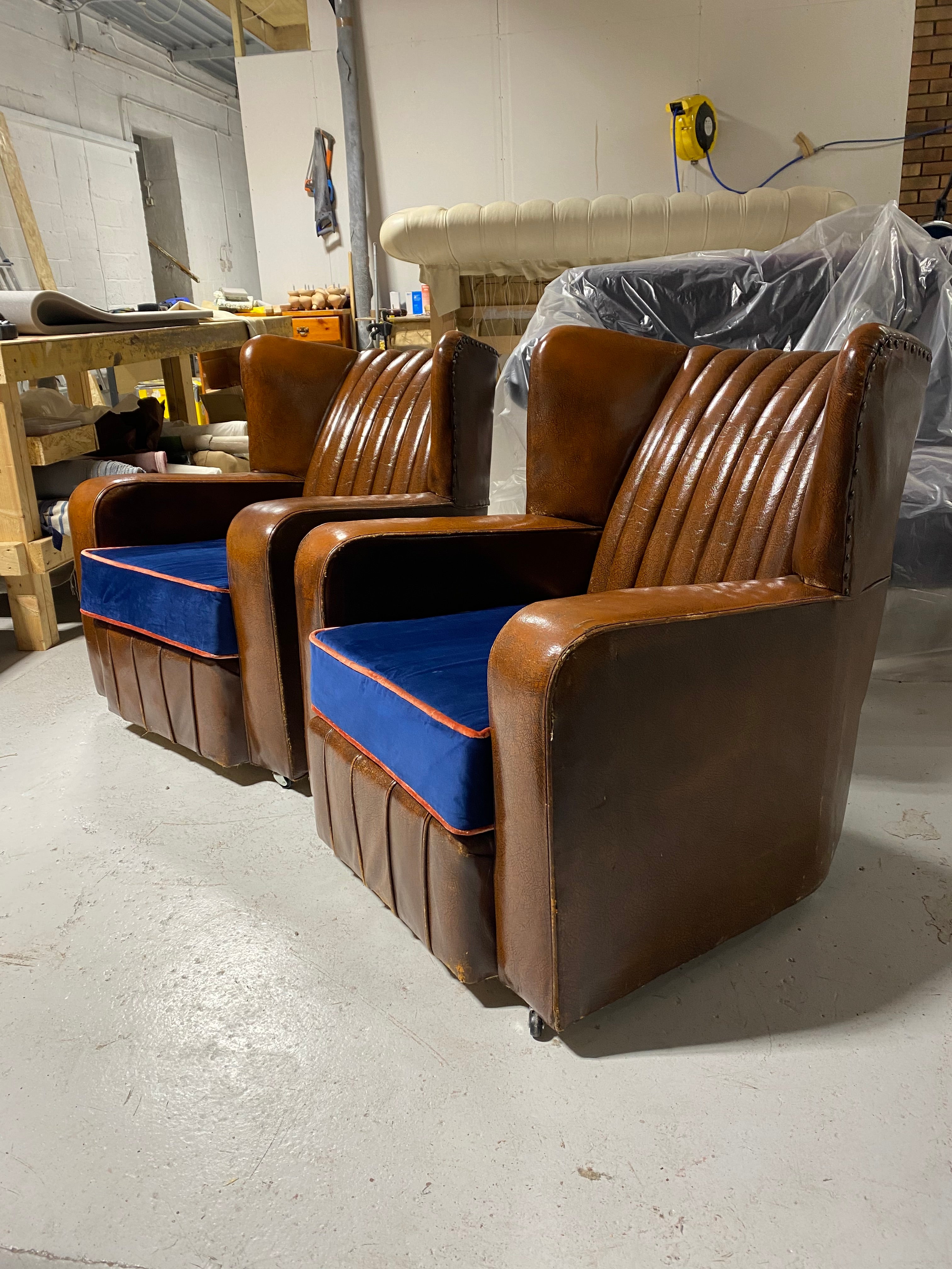 A Very Very Nice Matching Pair of Early Art Deco Leather Armchairs