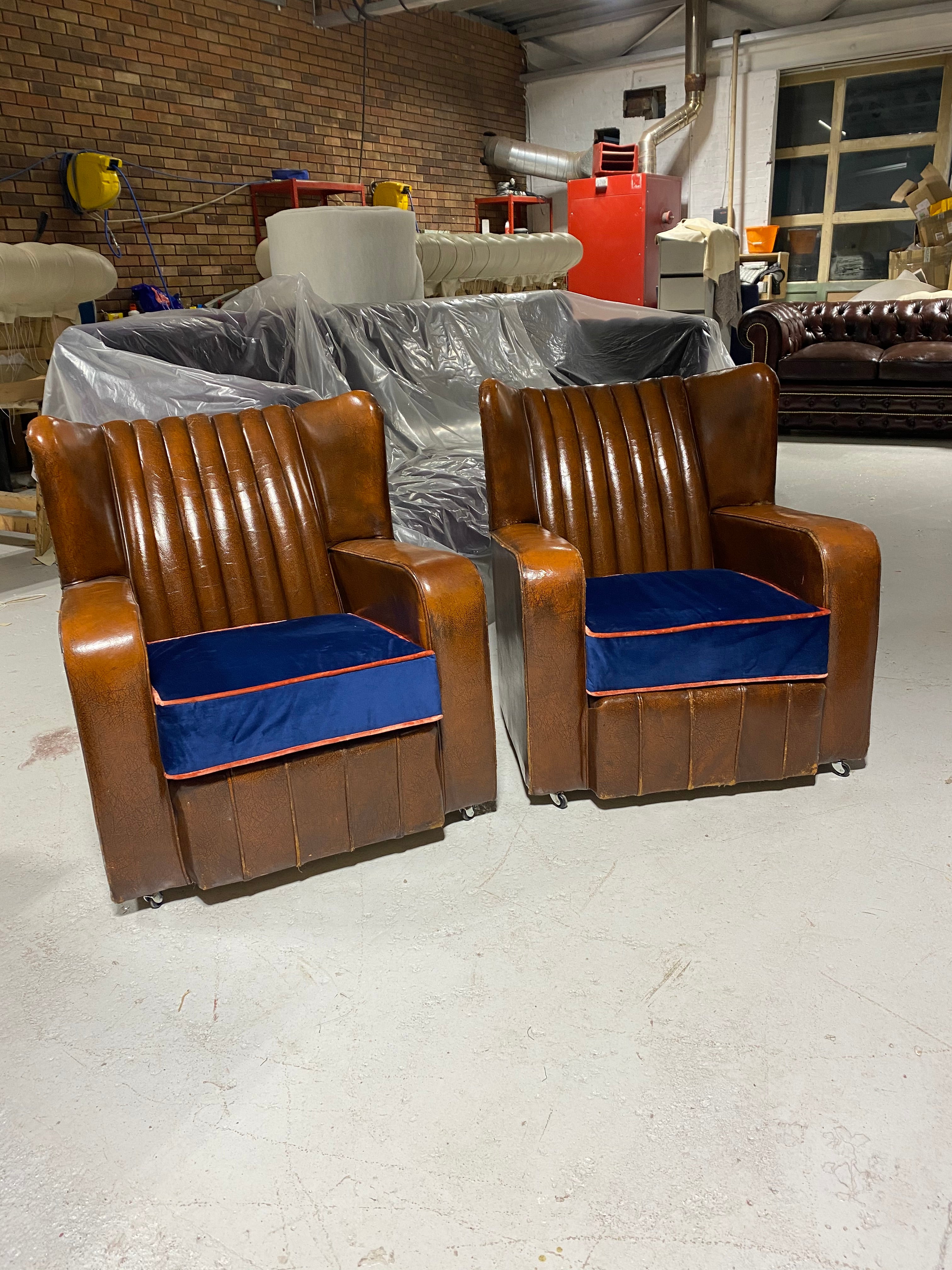 A Very Very Nice Matching Pair of Early Art Deco Leather Armchairs