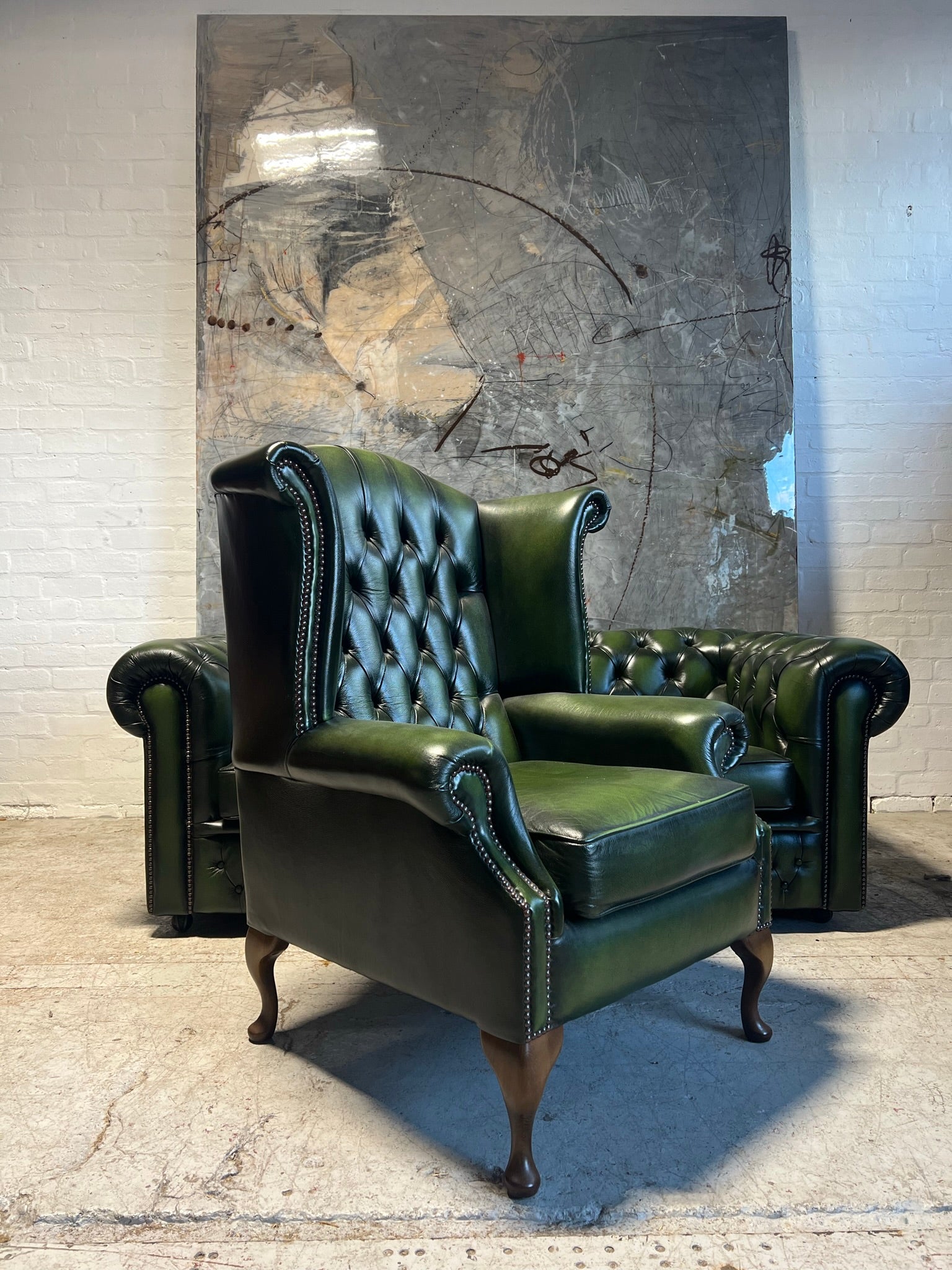 A Rich Green Leather Chesterfield Wing Back Chair