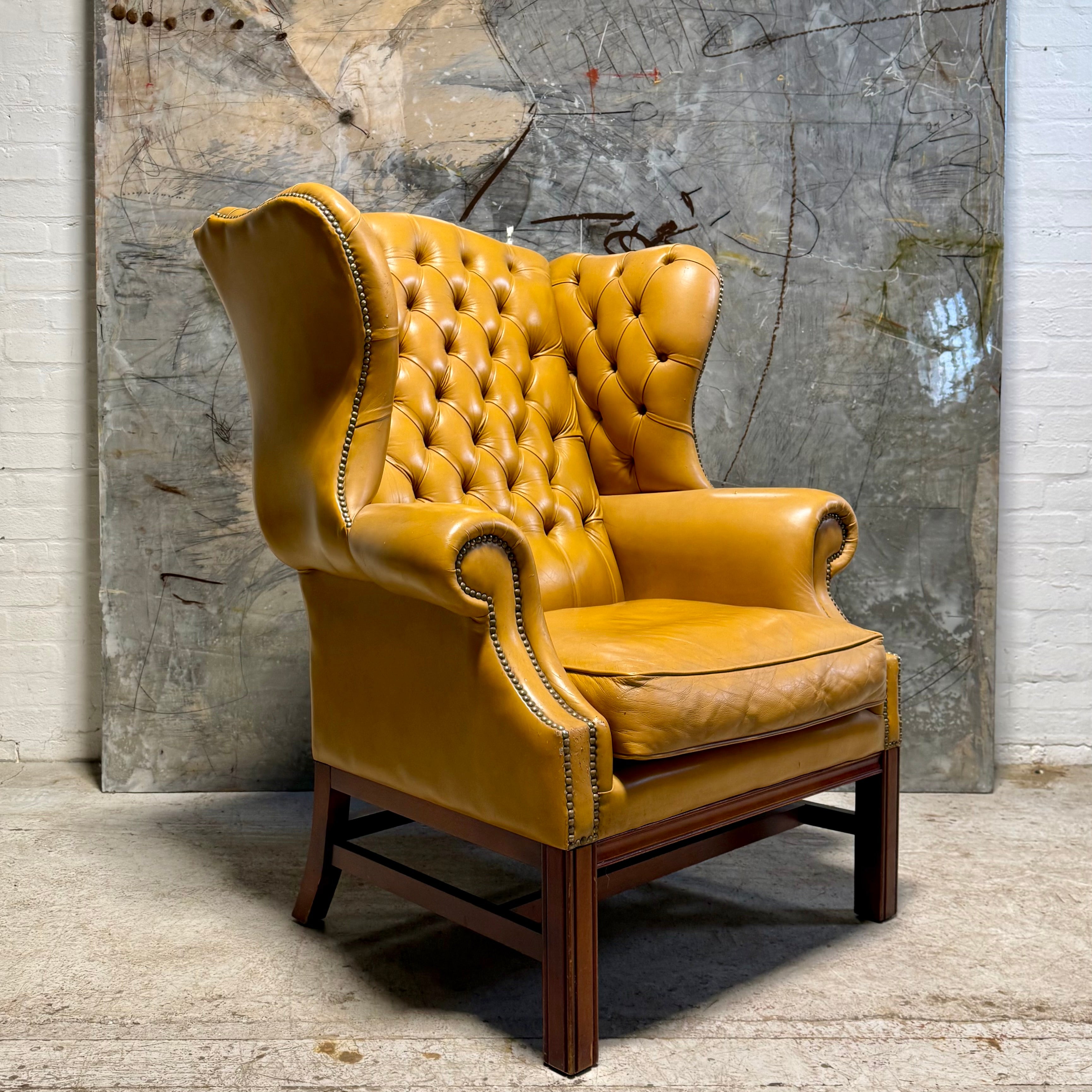 A HUGE Gentleman’s wing back chair at 100cm wide
