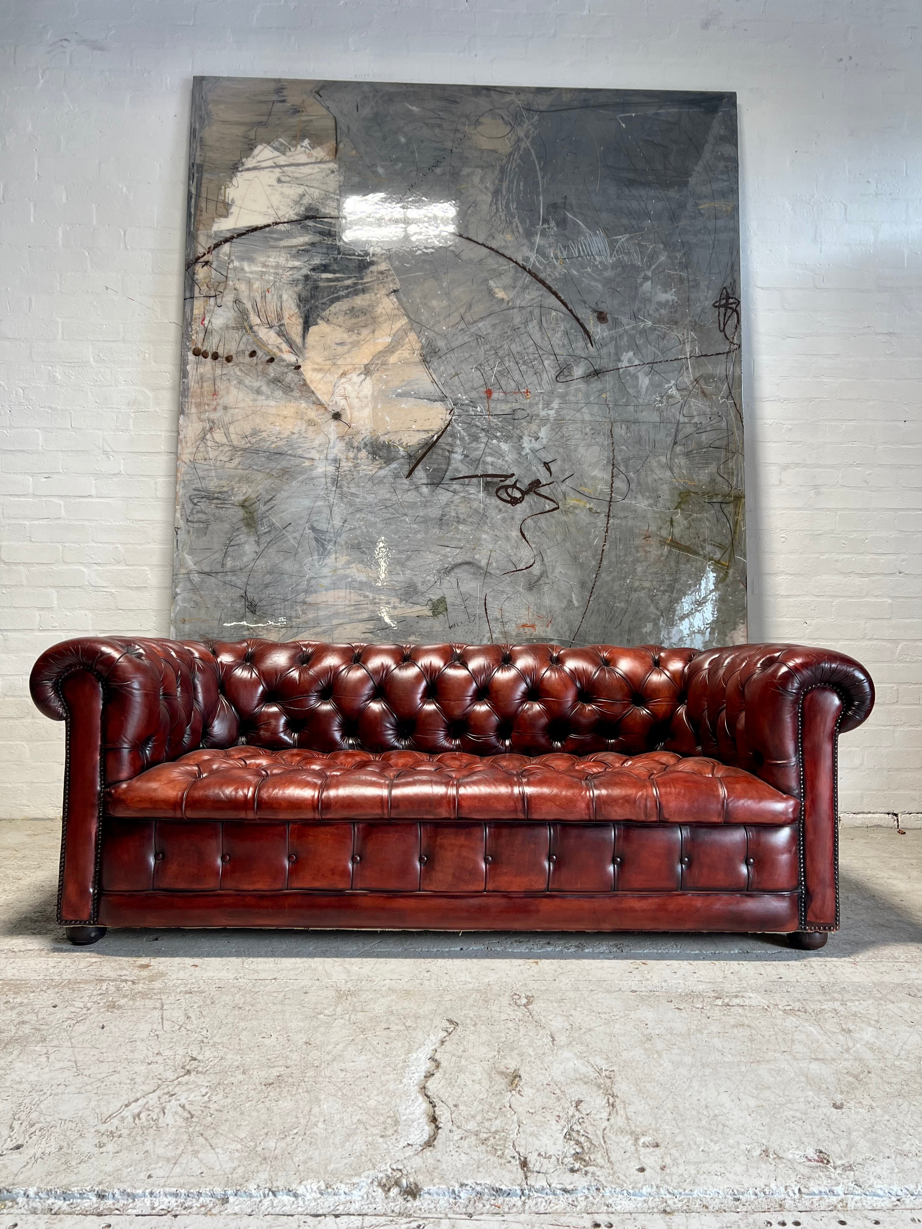 A Beautiful MidC Vintage Leather Chesterfield Sofa in Hand Dyed Cognac