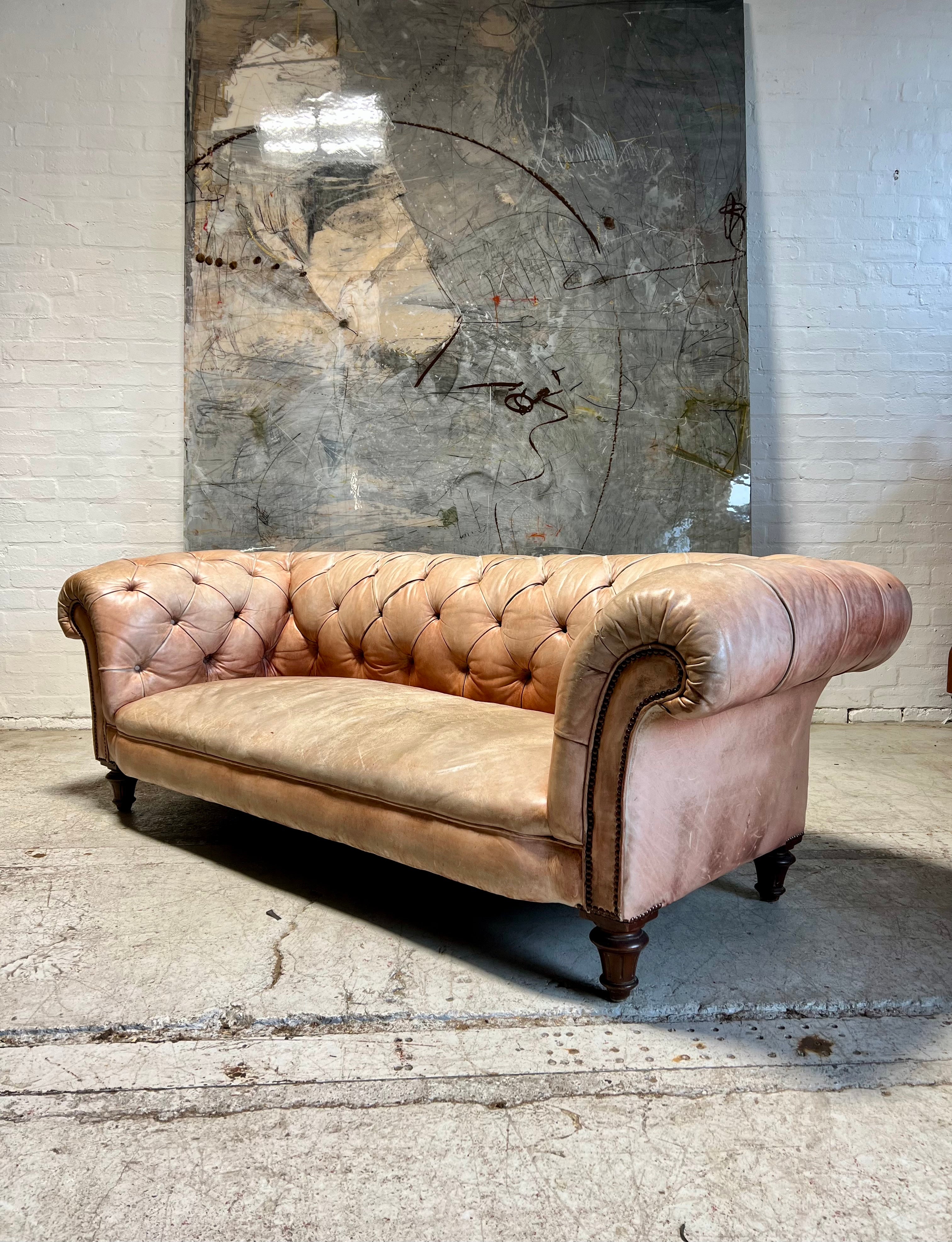 A Waring & Gillow Chesterfield Sofa in Faded Coral Hand Dyed Leathers