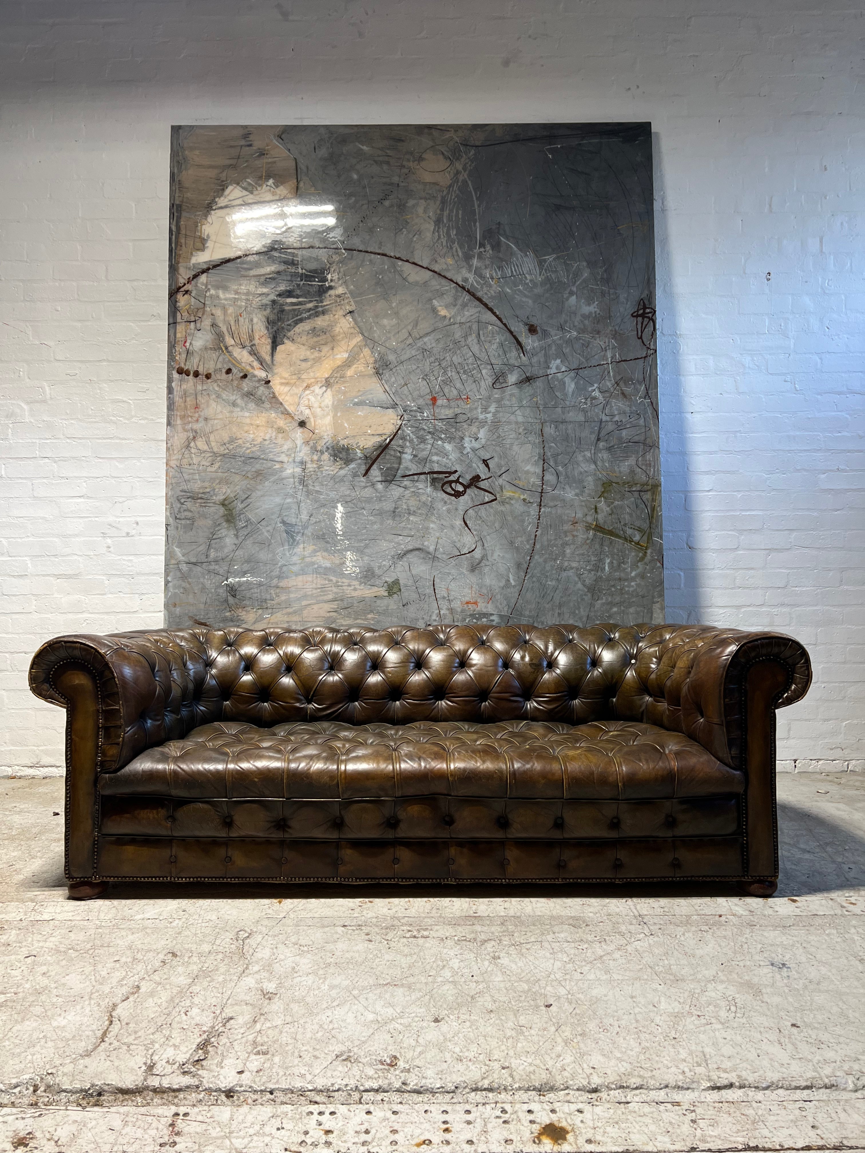 From Robbie William’s Compton Basset House - A Very Good MidC Hand Dyed Leather Chesterfield Sofa