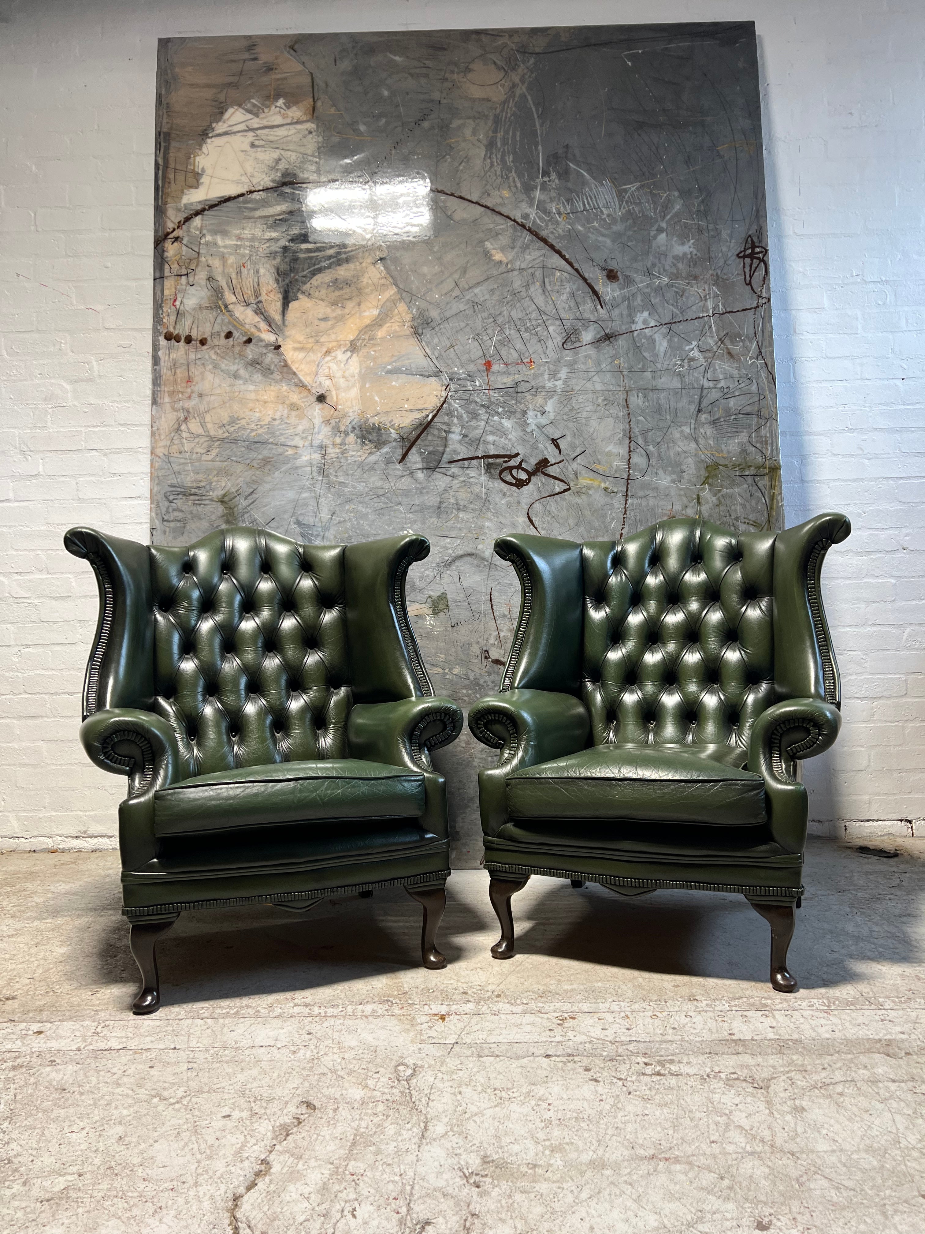 A Very Smart Pair of Racing Green Wing Back Chairs with Ottoman