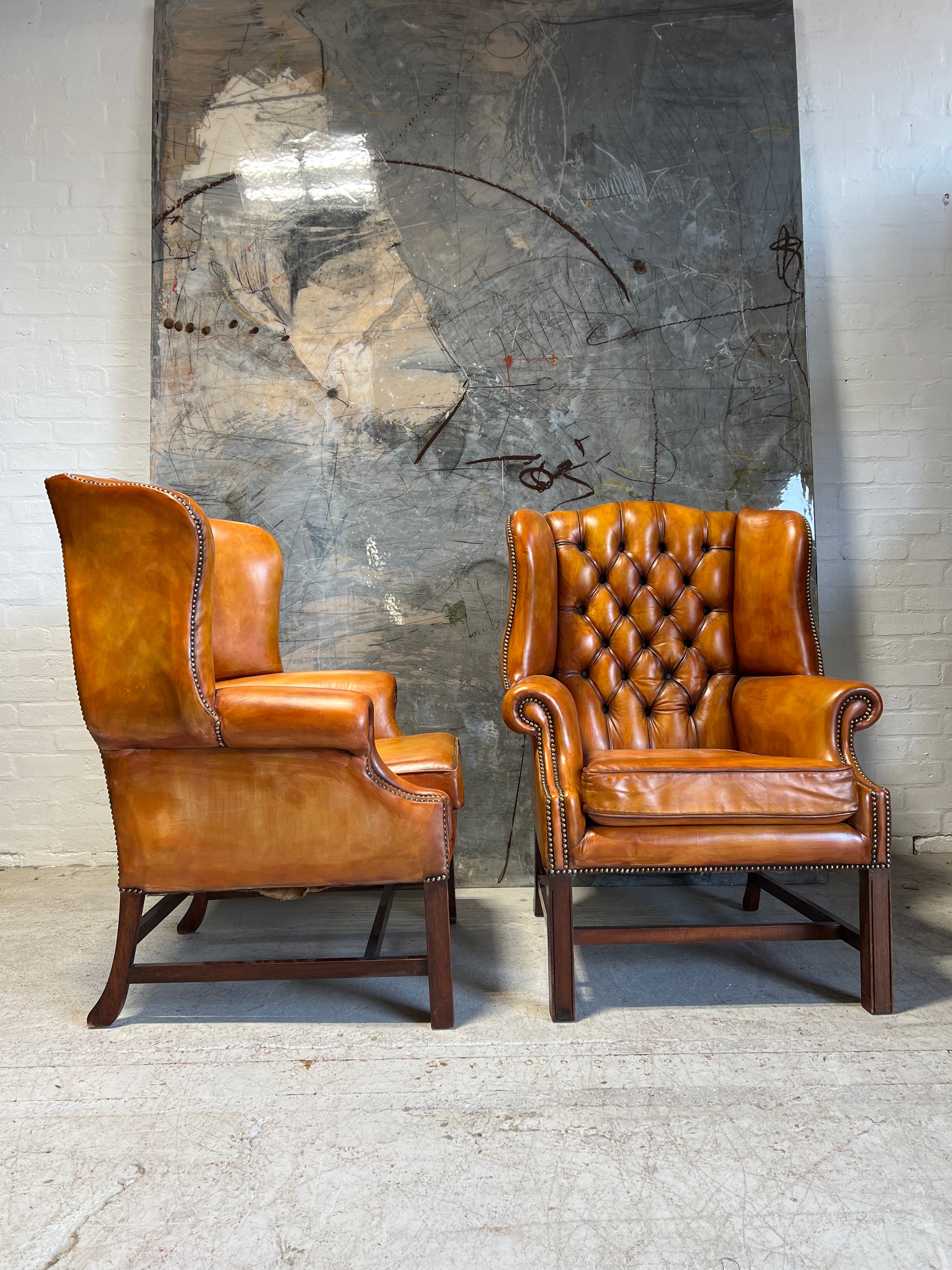 An Stunning Matching Pair of MidC Gentleman’s Wing Chairs in Original Leathers