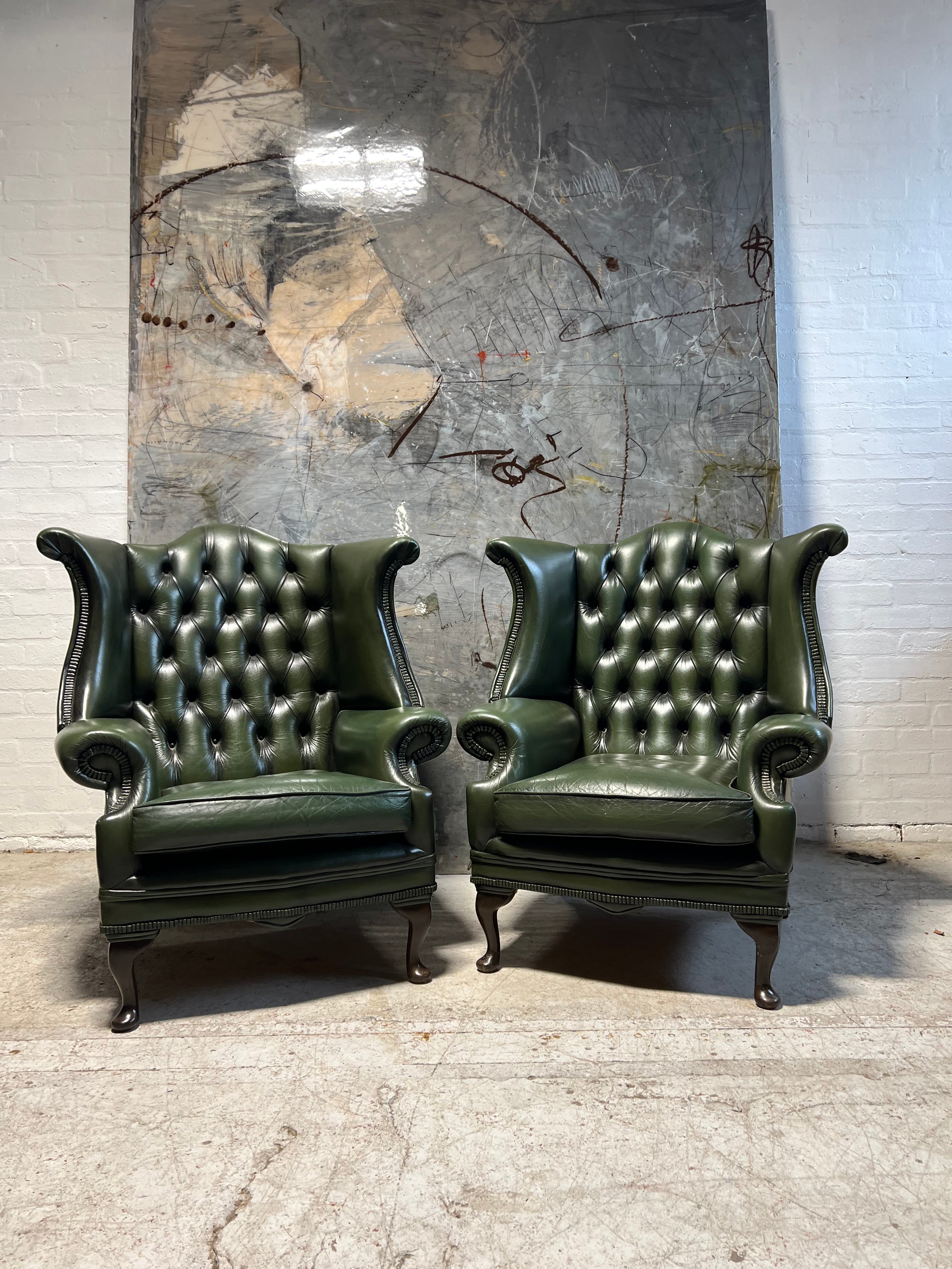 A Very Smart Pair of Racing Green Wing Back Chairs with Ottoman