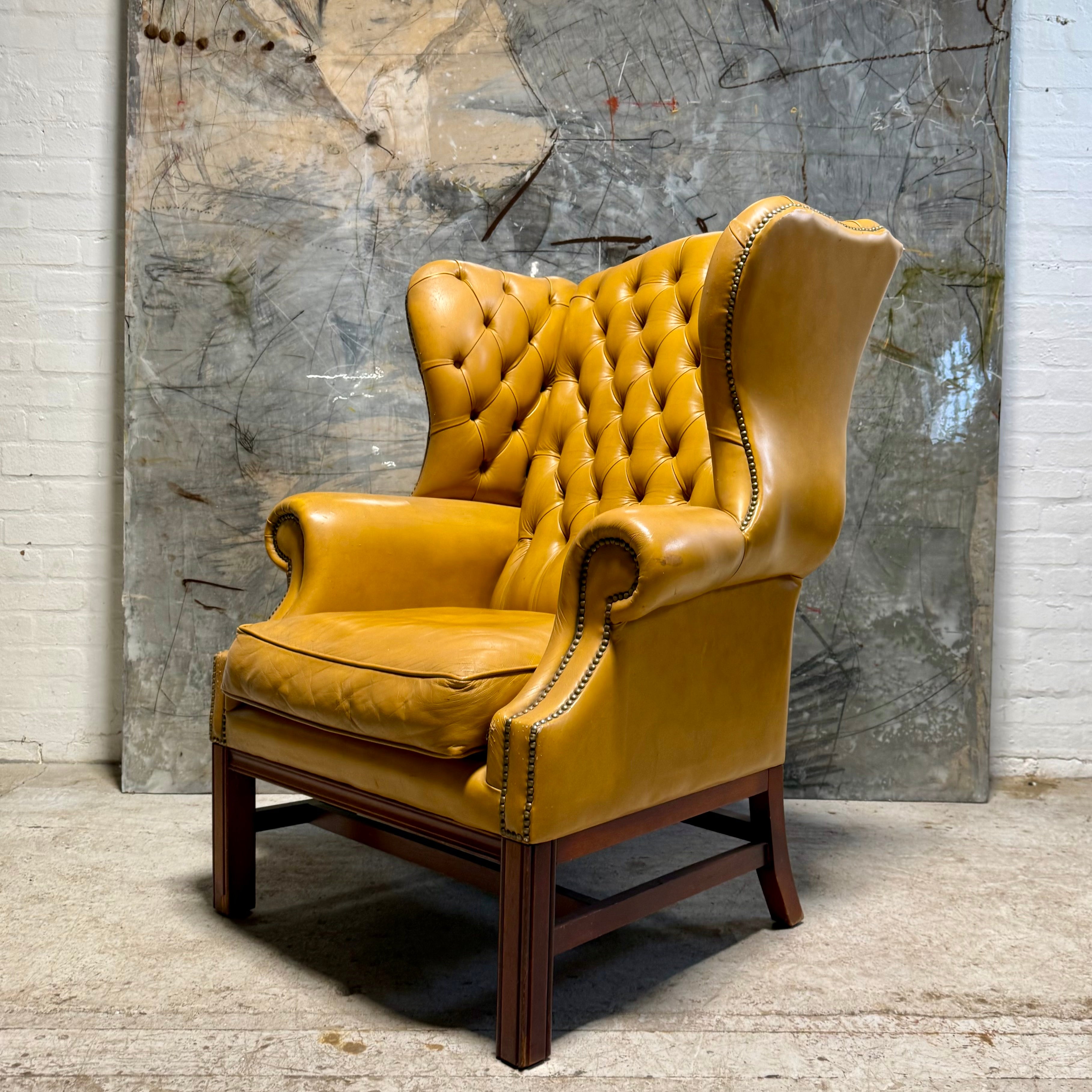 A HUGE Gentleman’s wing back chair at 100cm wide
