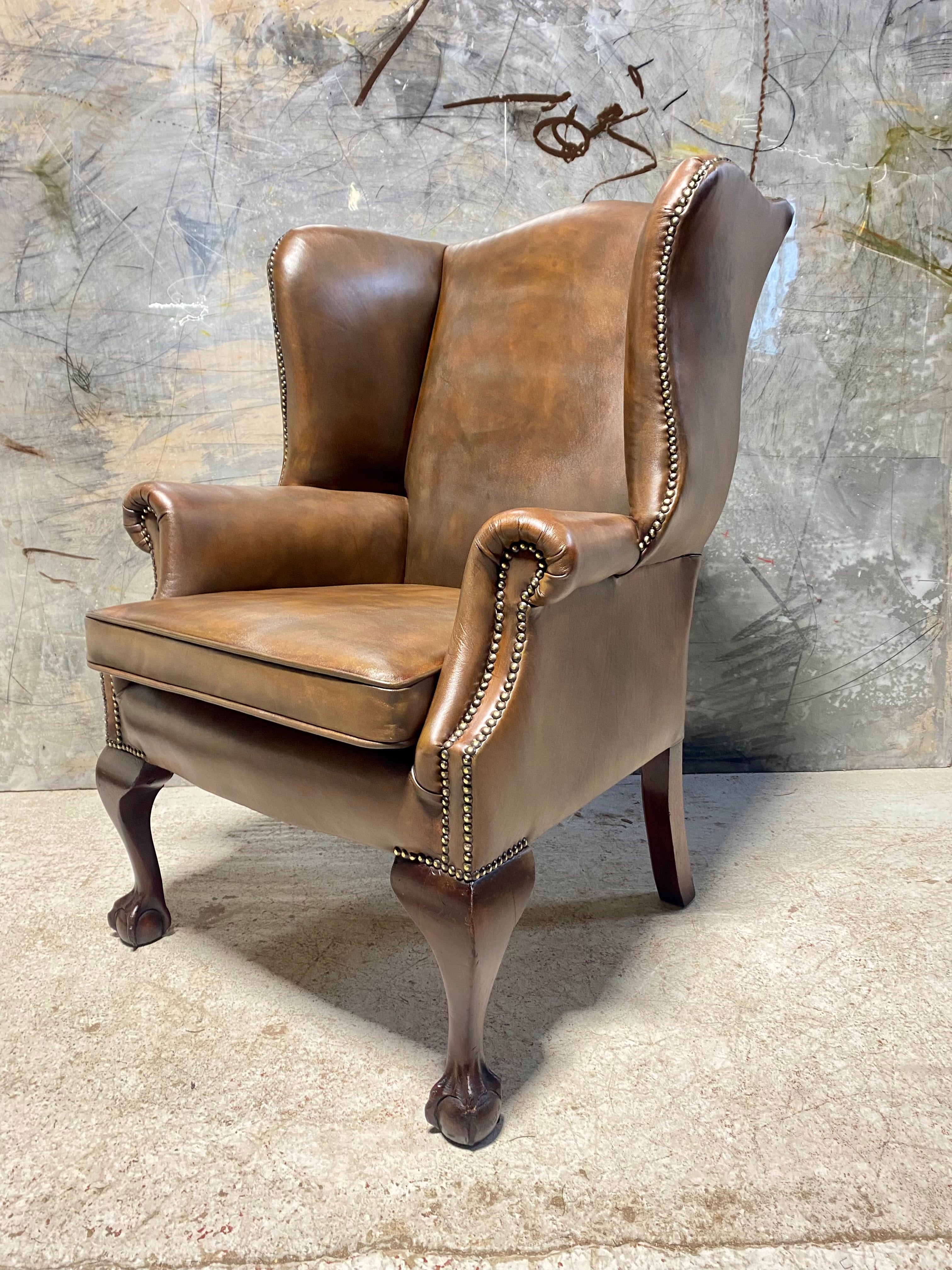 A Beautifully Restored MidC Vintage Gentleman’s Wing Back Chair in Hand Dyed Leather