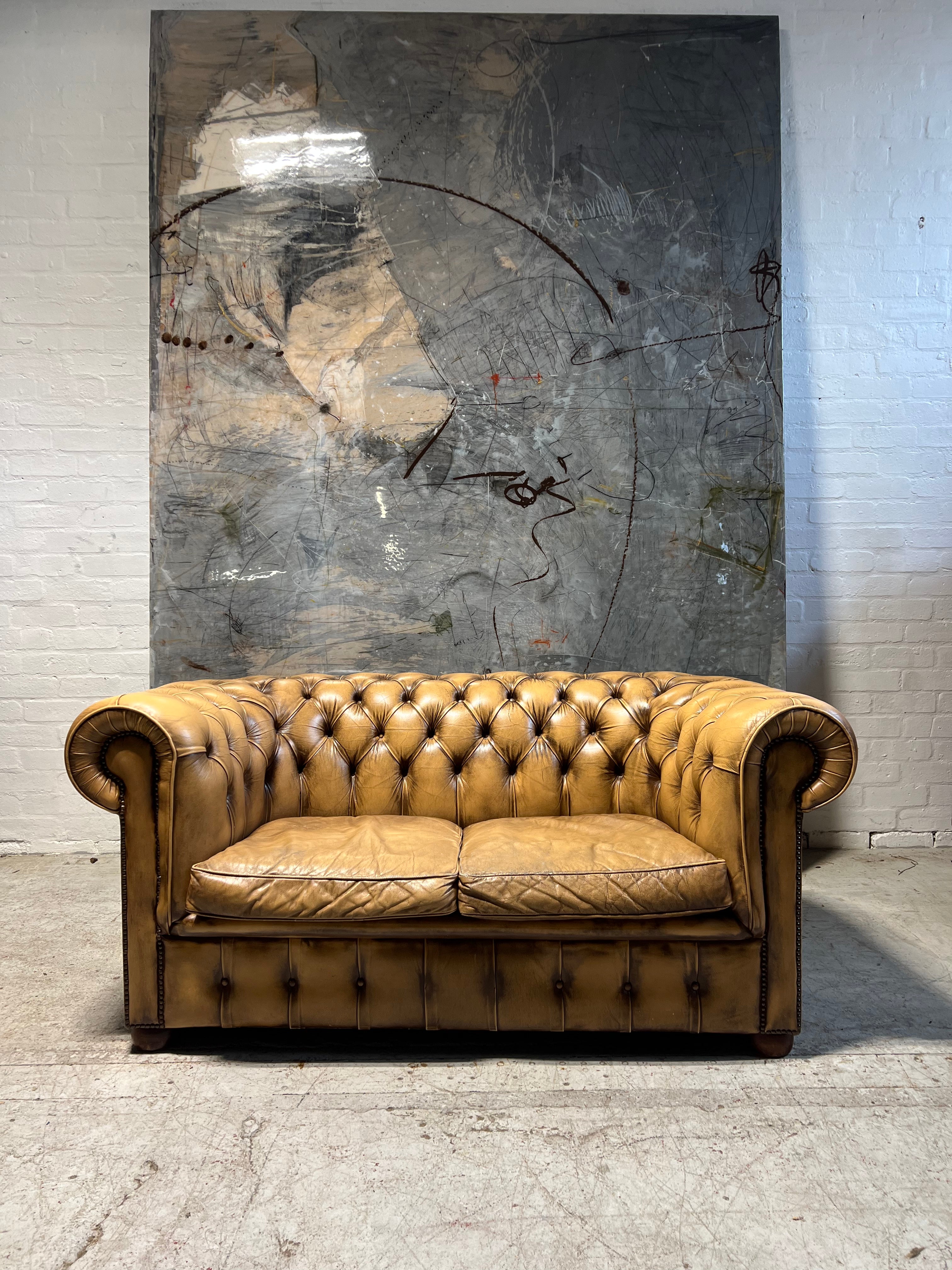 A Great Matching Pair of Light Tan Leather Chesterfield Sofas