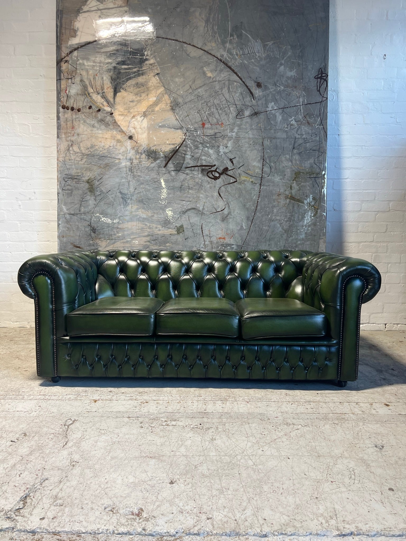 A lovely Rich Green Leather 3 Seater Chesterfield Sofa