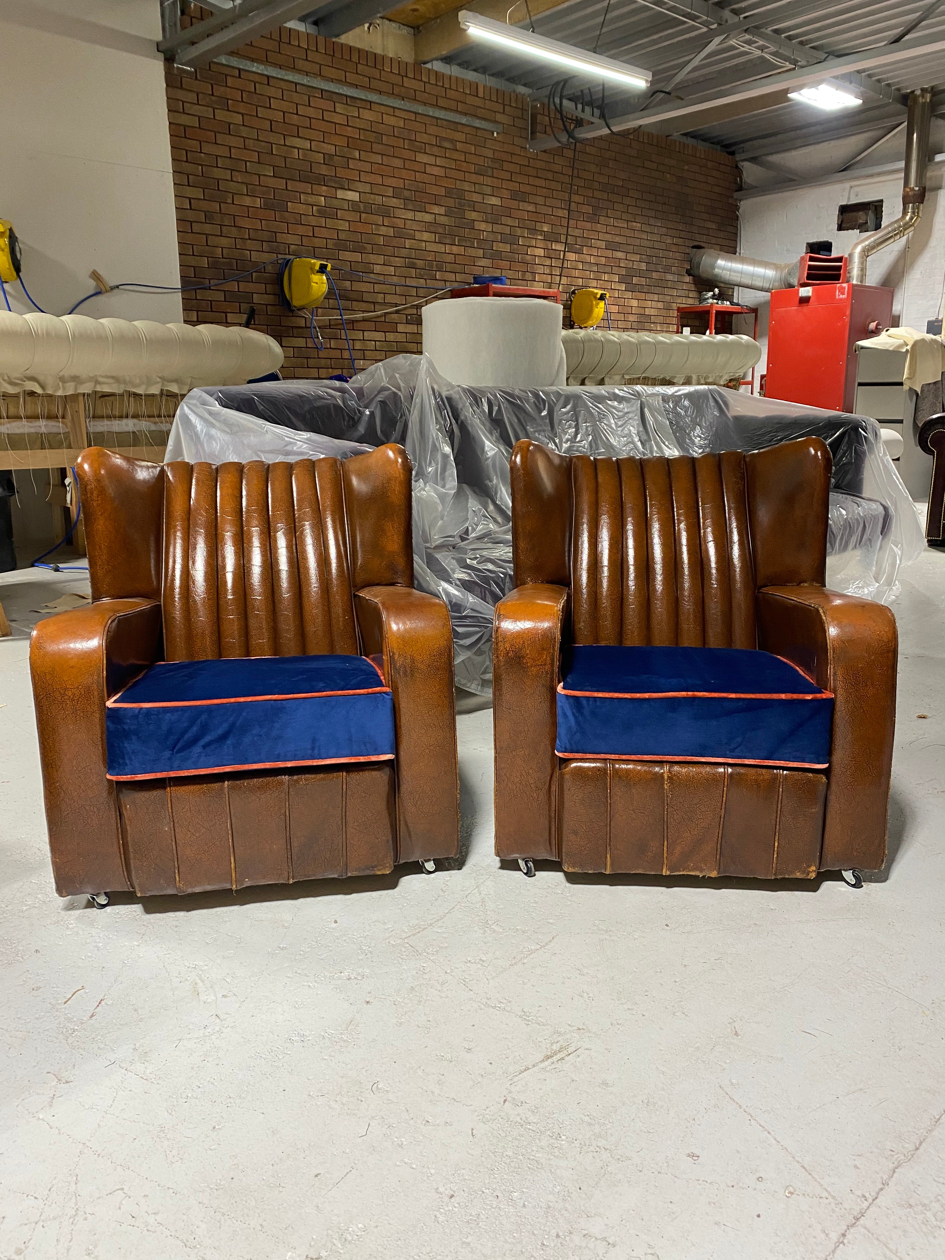 A Very Very Nice Matching Pair of Early Art Deco Leather Armchairs