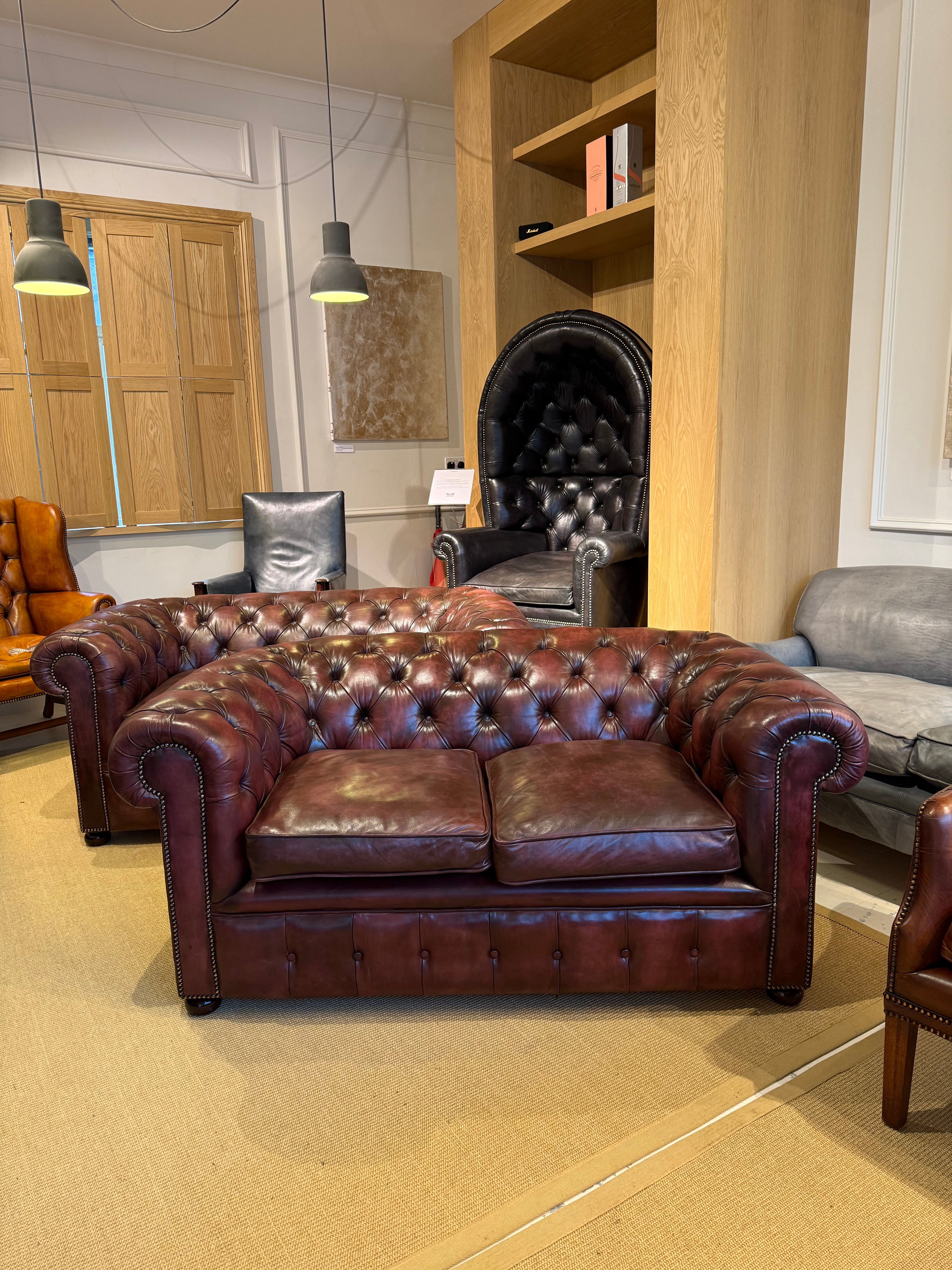 Fully Restored Matching Pair of Mid Century Leather Chesterfield Sofas