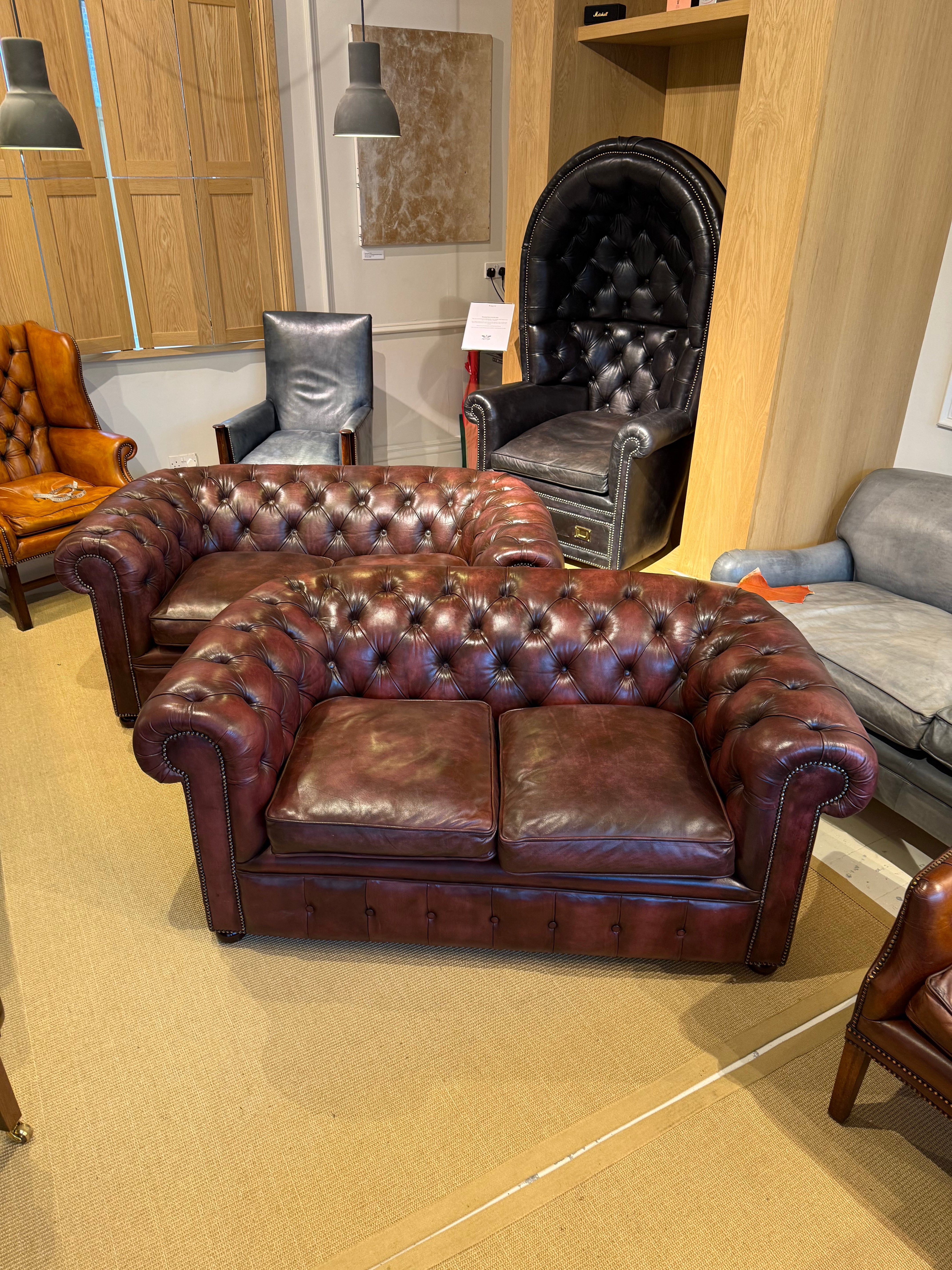 Fully Restored Matching Pair of Mid Century Leather Chesterfield Sofas