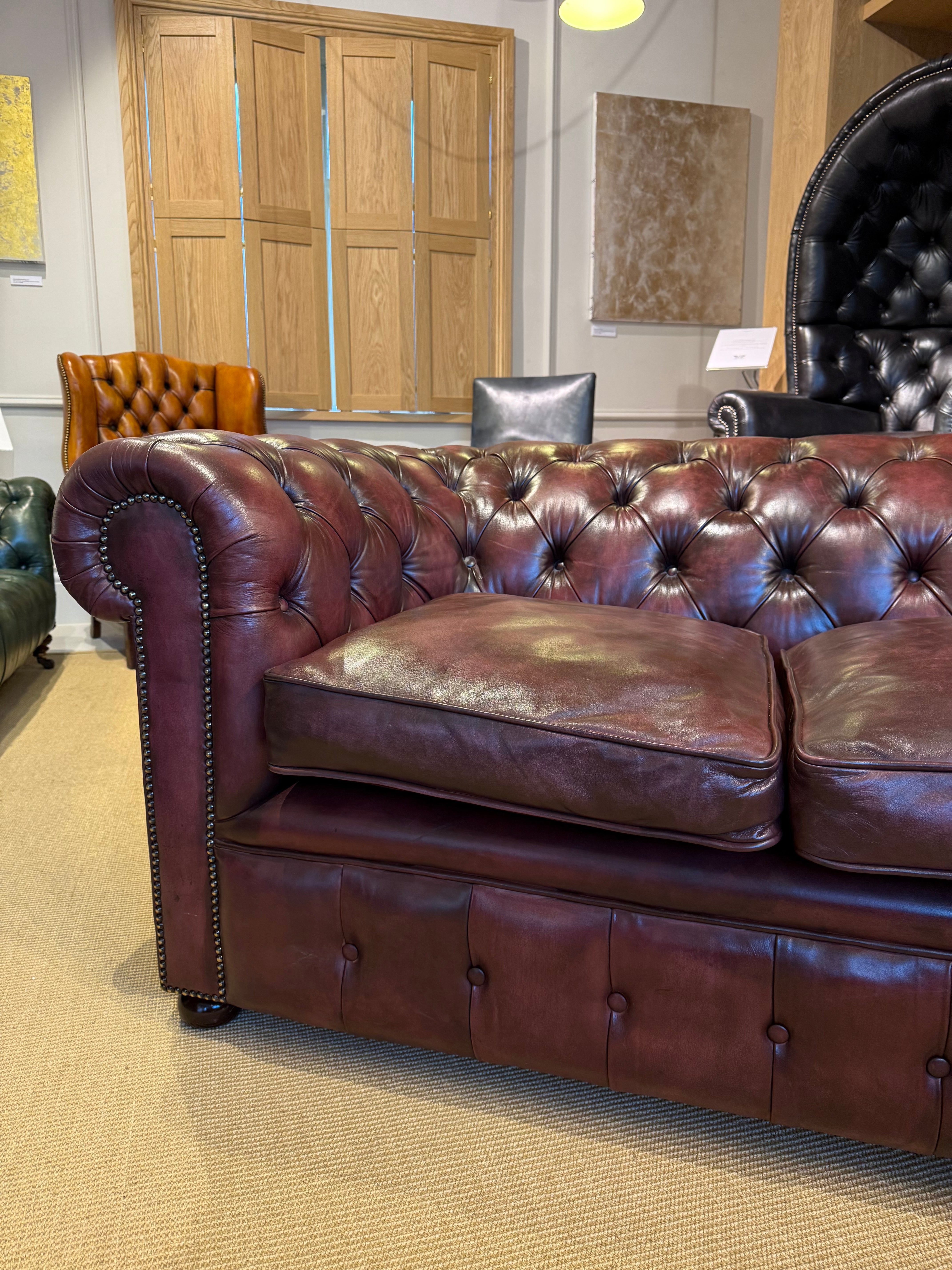 Fully Restored Matching Pair of Mid Century Leather Chesterfield Sofas