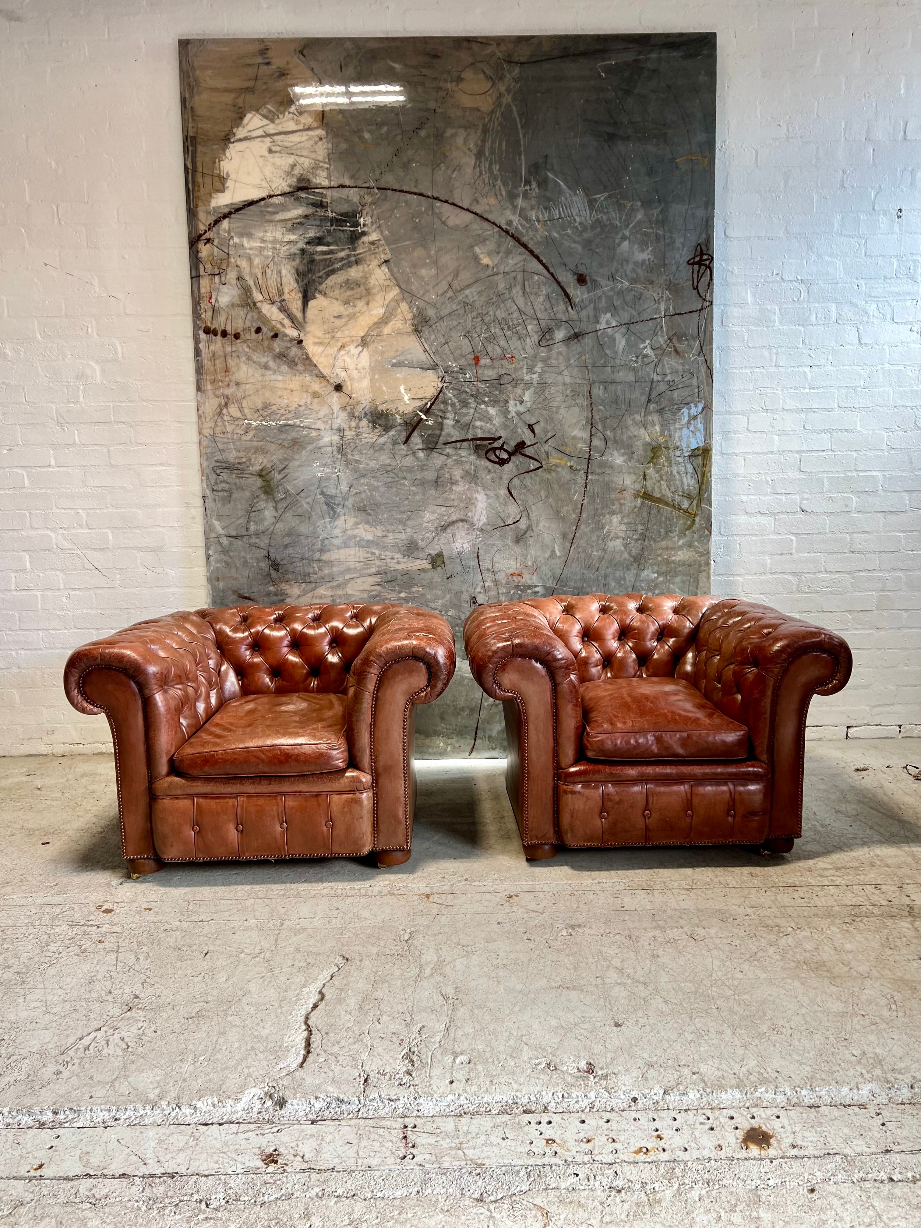 An Exquisite Matching Pair of Early 20thC Leather Chesterfield Club Chairs circa 1920