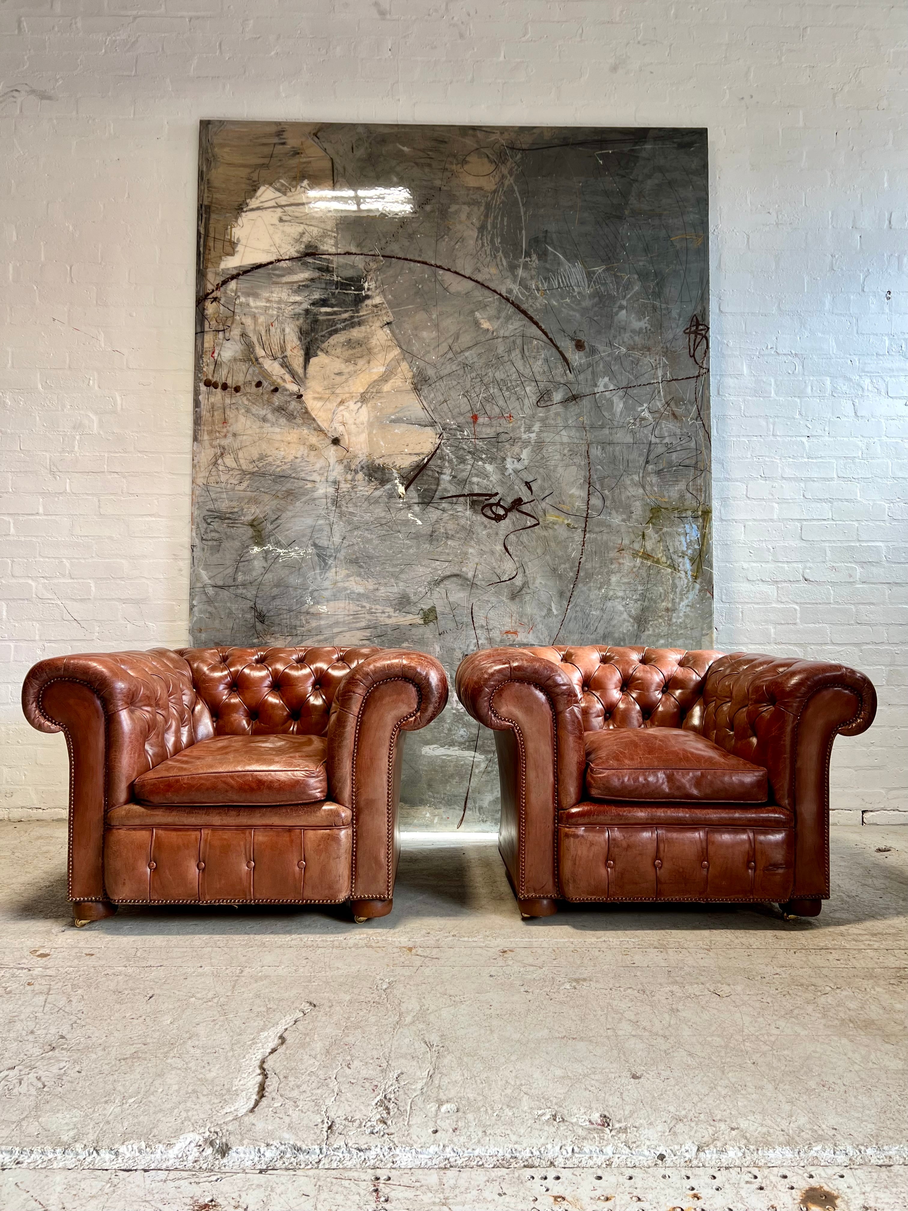 An Exquisite Matching Pair of Early 20thC Leather Chesterfield Club Chairs circa 1920