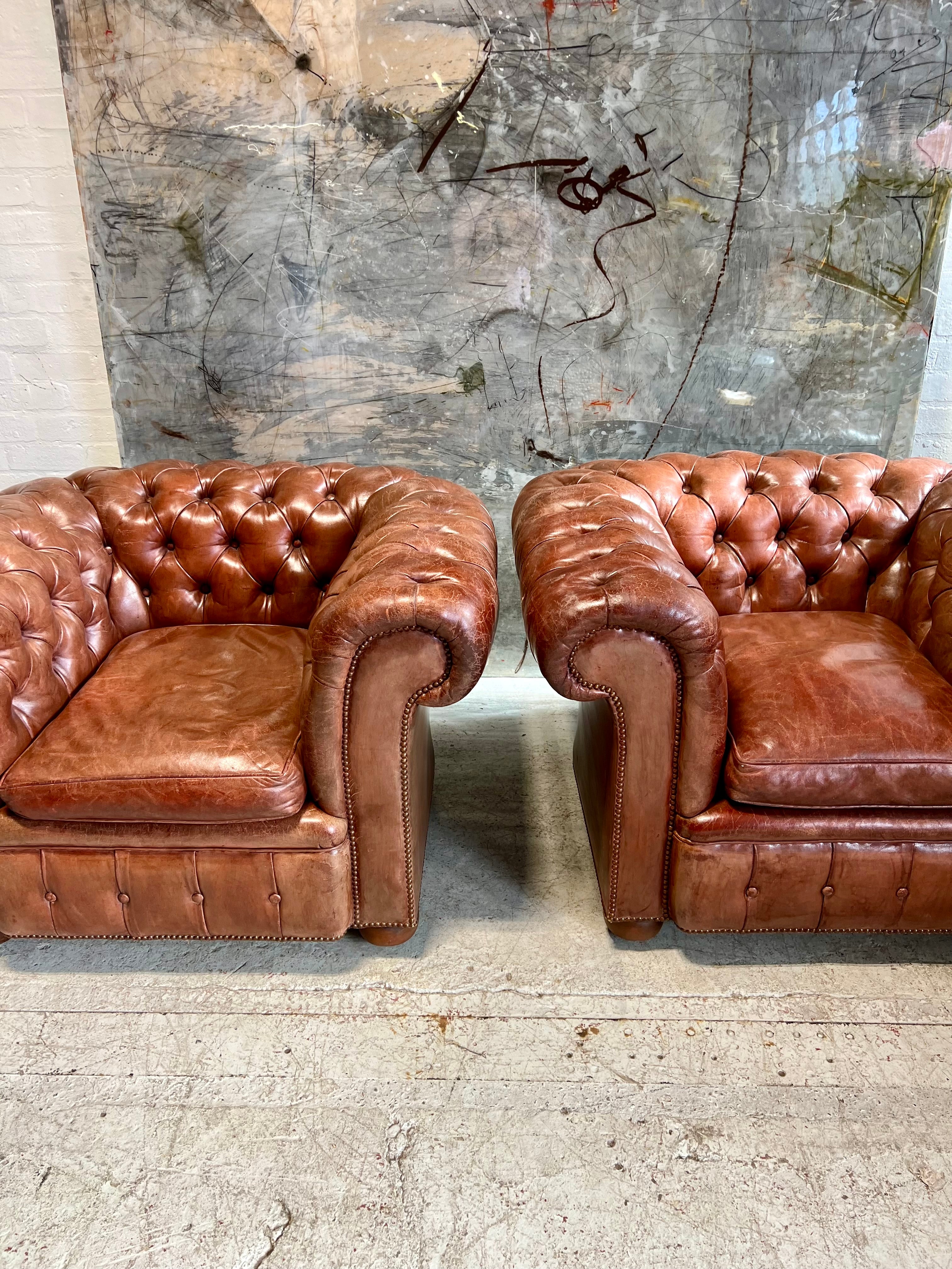 An Exquisite Matching Pair of Early 20thC Leather Chesterfield Club Chairs circa 1920