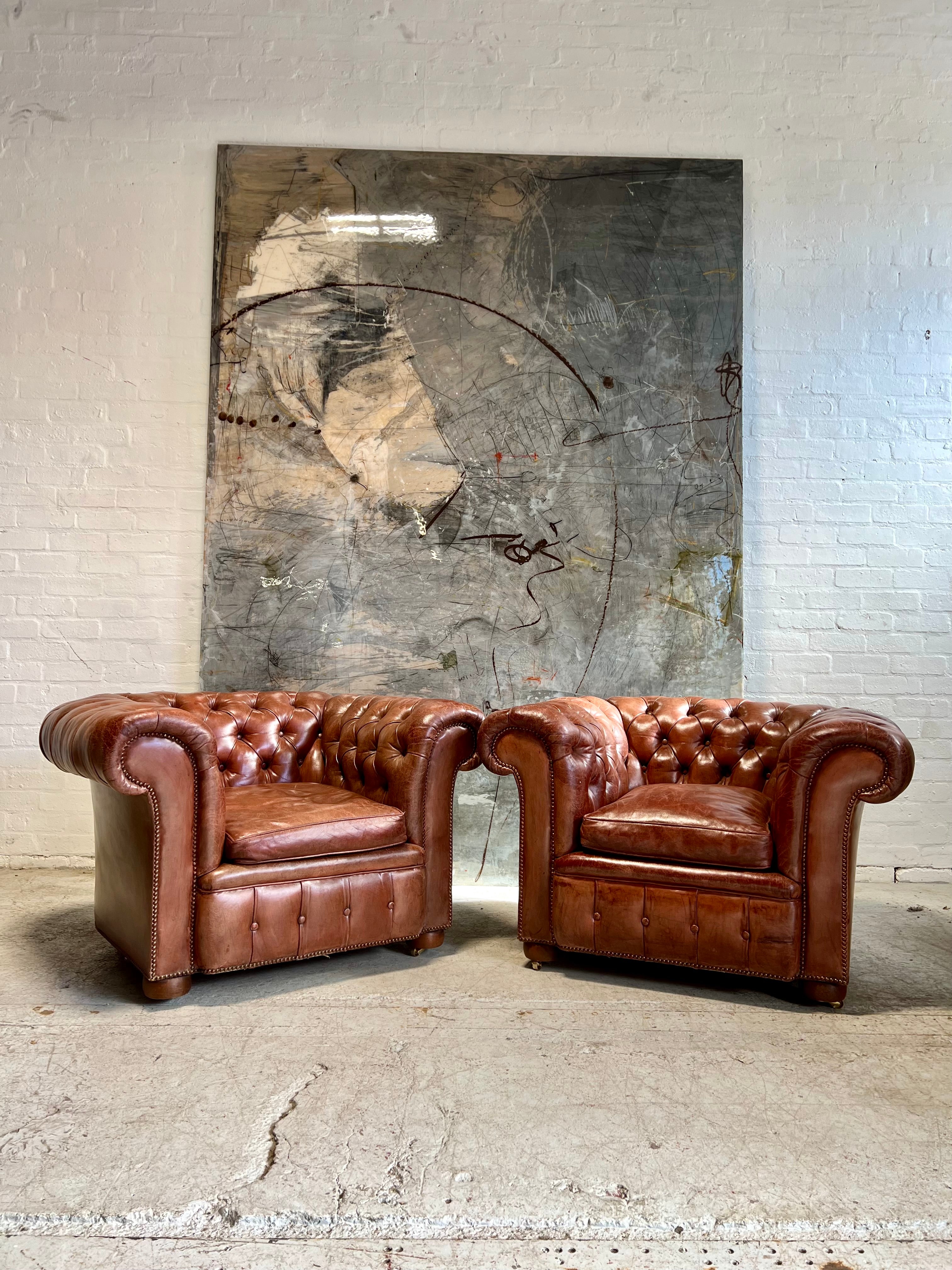 An Exquisite Matching Pair of Early 20thC Leather Chesterfield Club Chairs circa 1920