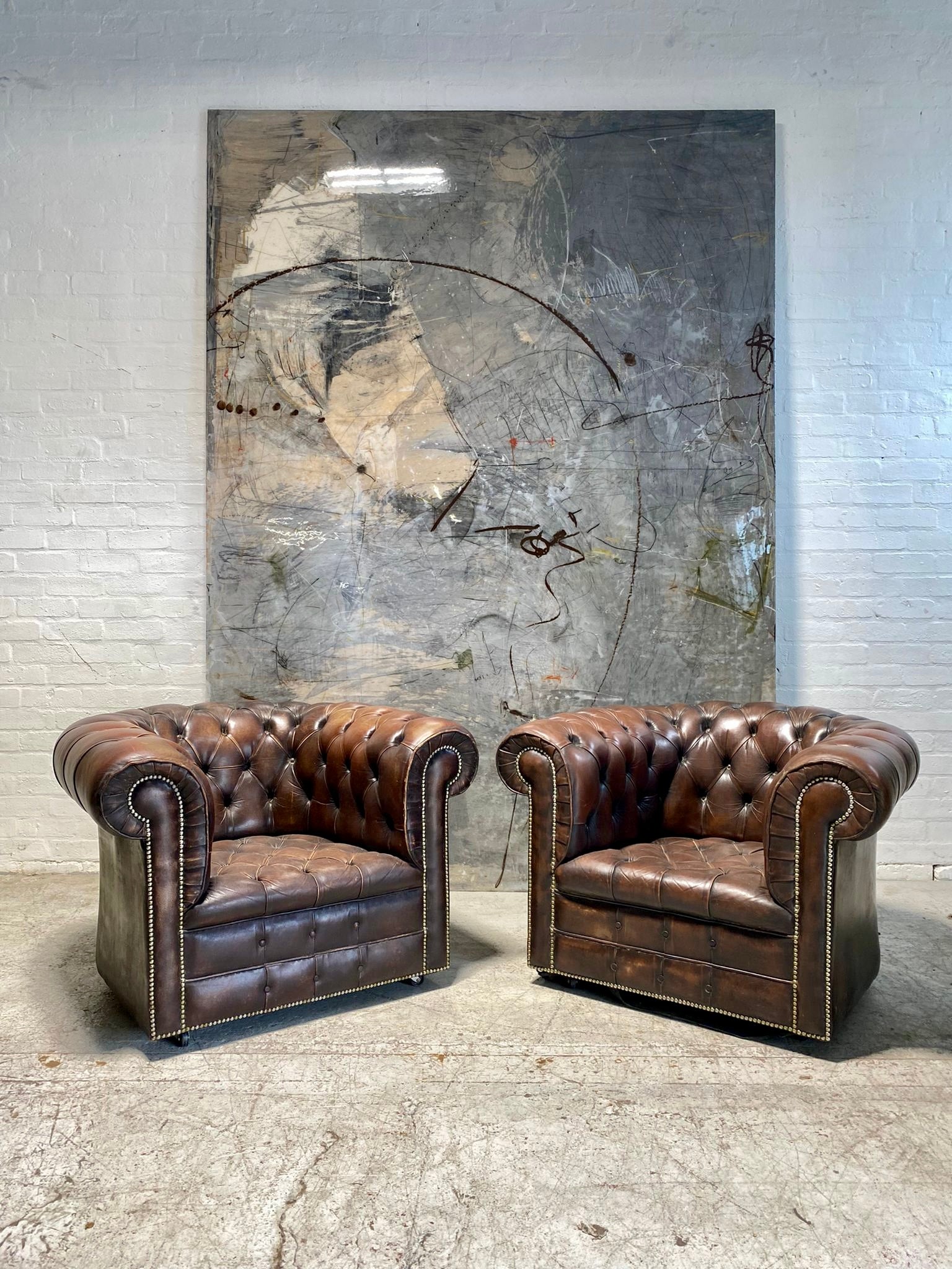 Matching Pair of MidC Leather Chesterfield Club Chairs