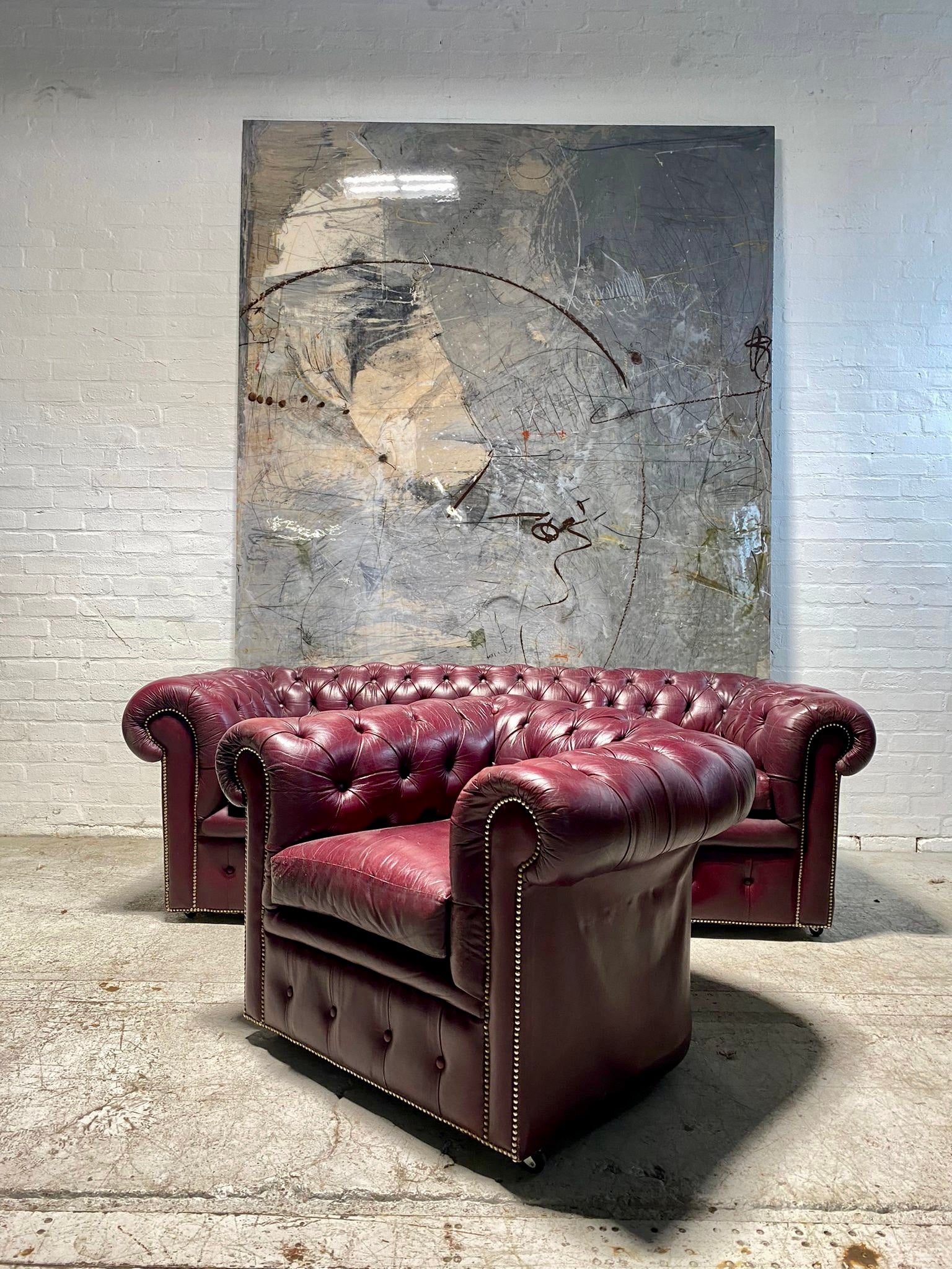 A Very Good Vintage Leather Chesterfield Sofa & Club Armchair in Rasberry Leathers