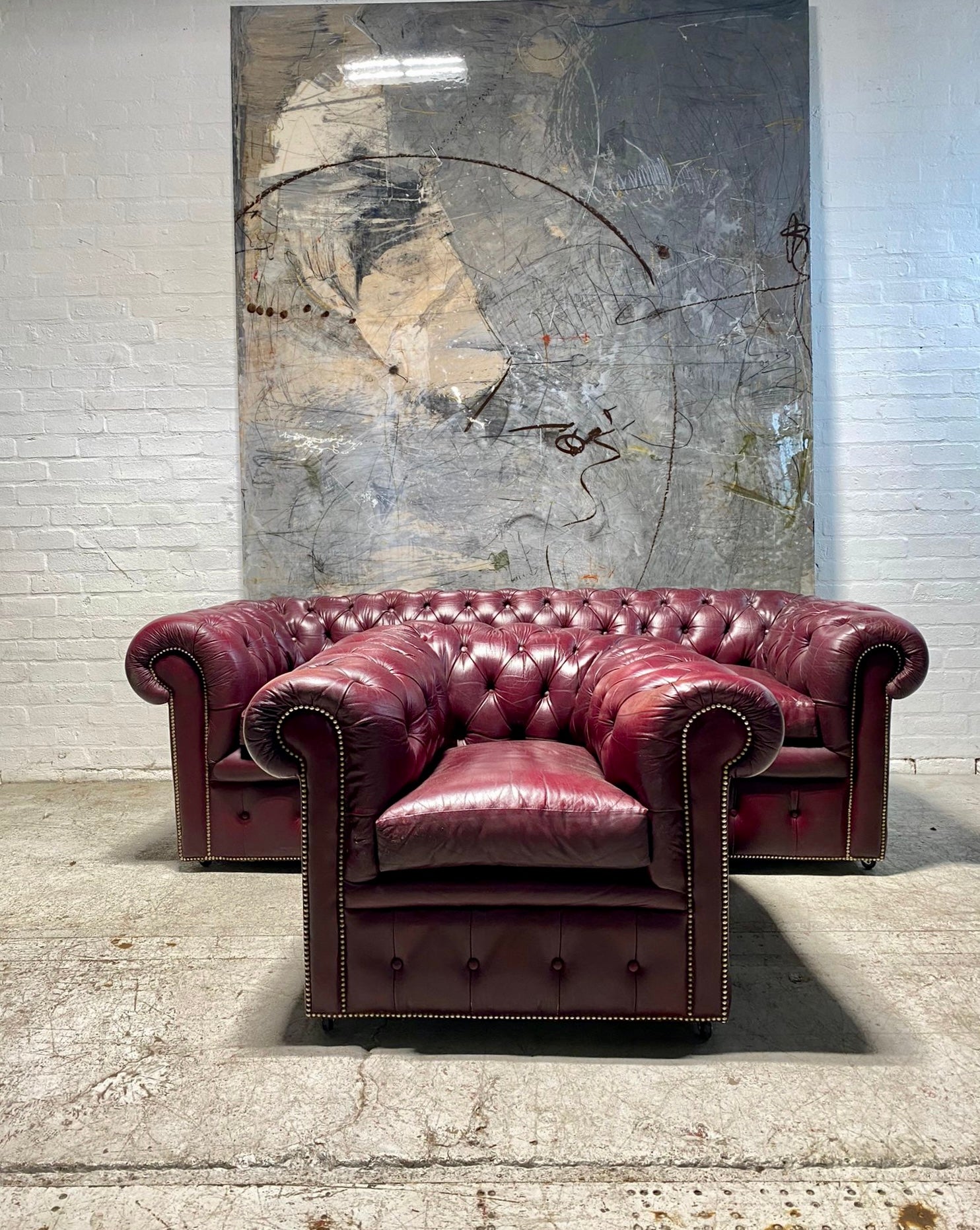 A Very Good Vintage Leather Chesterfield Sofa & Club Armchair in Rasberry Leathers