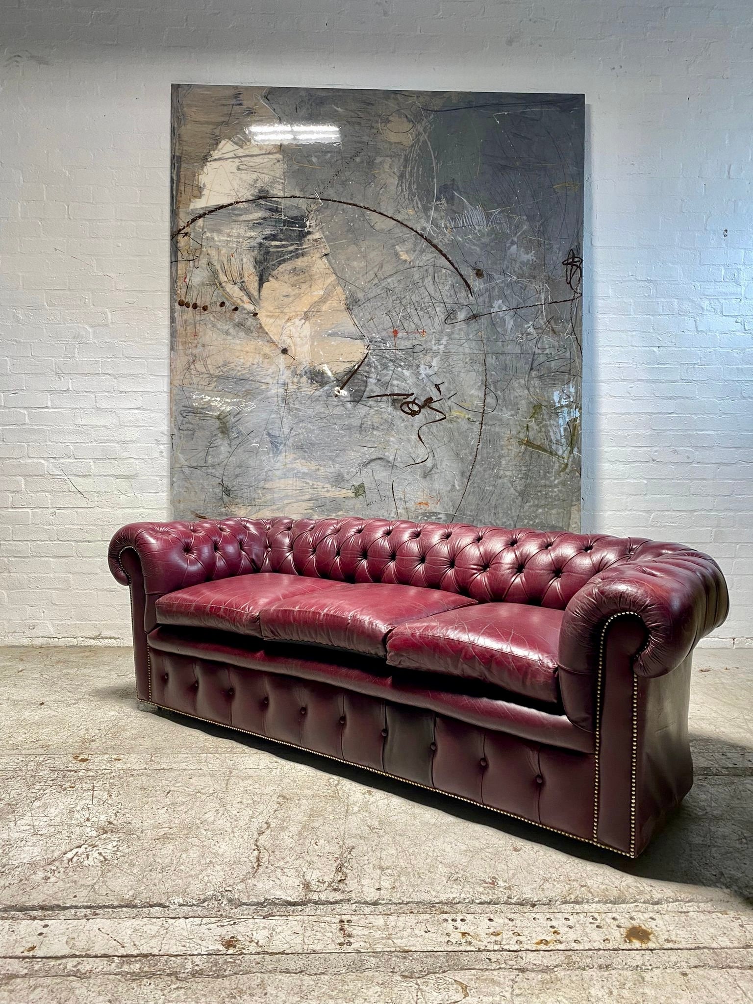 A Very Good Vintage Leather Chesterfield Sofa & Club Armchair in Rasberry Leathers