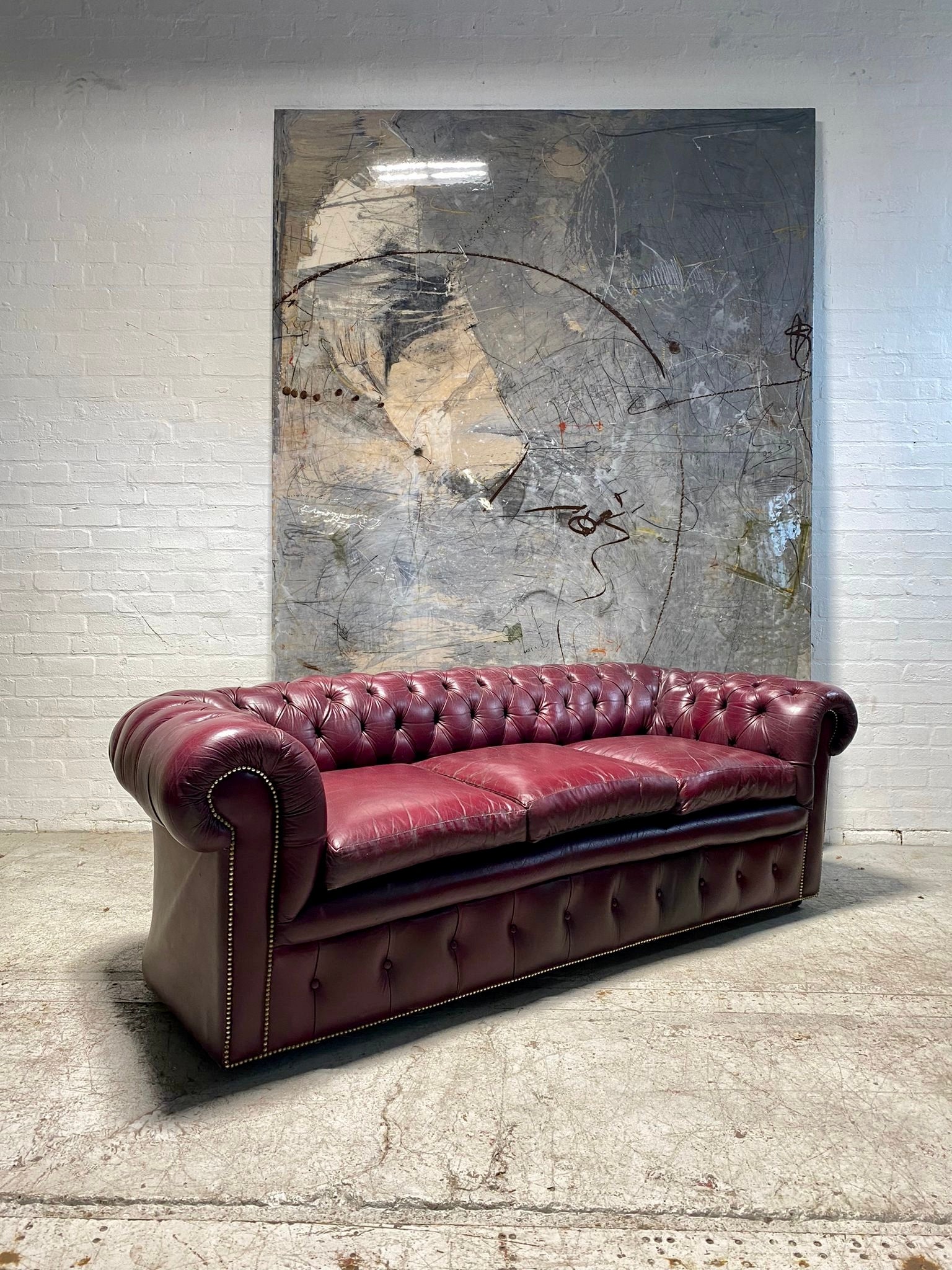 A Very Good Vintage Leather Chesterfield Sofa & Club Armchair in Rasberry Leathers