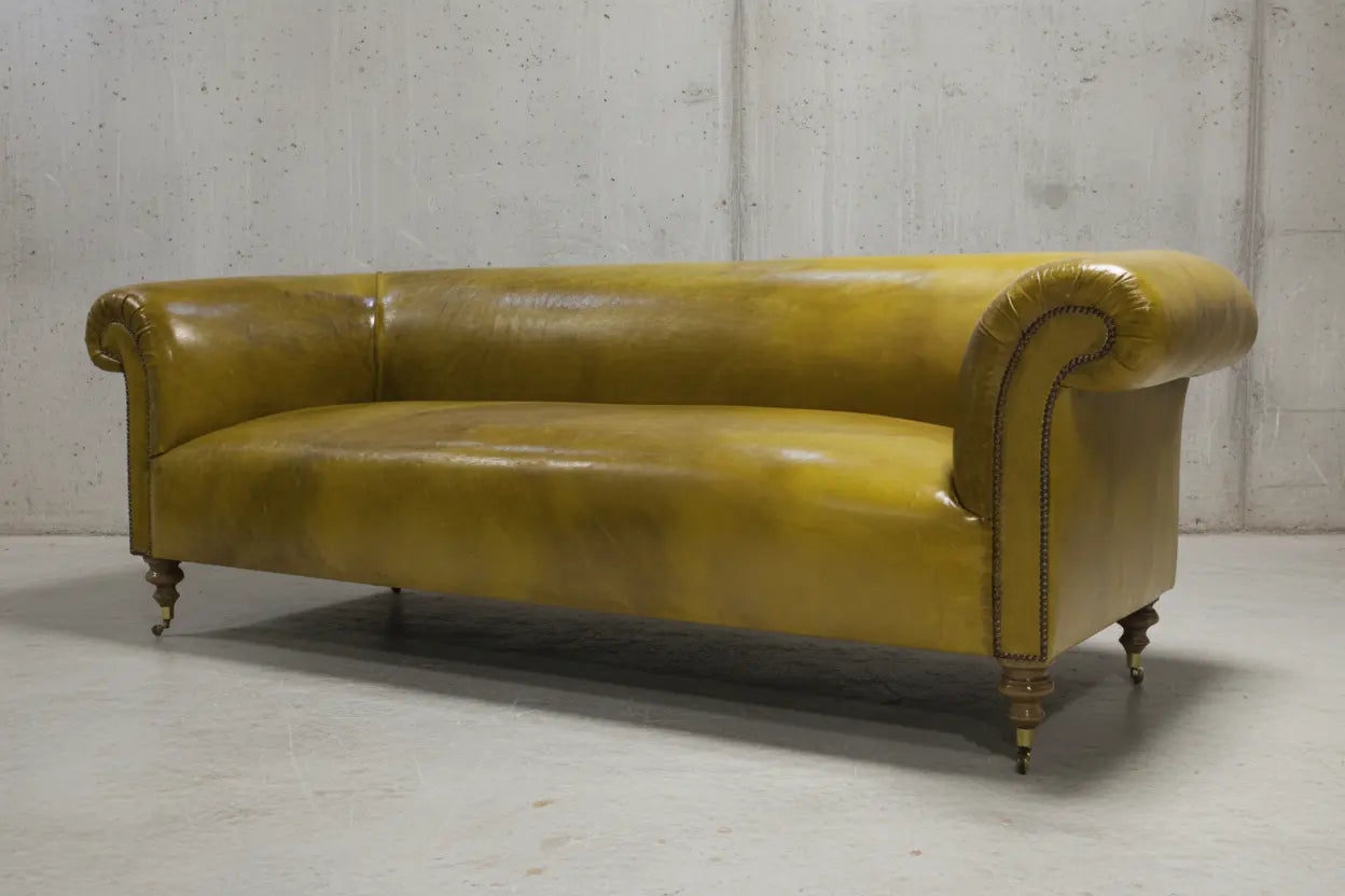 Sandstone tan leather unbuttoned chesterfield sofa